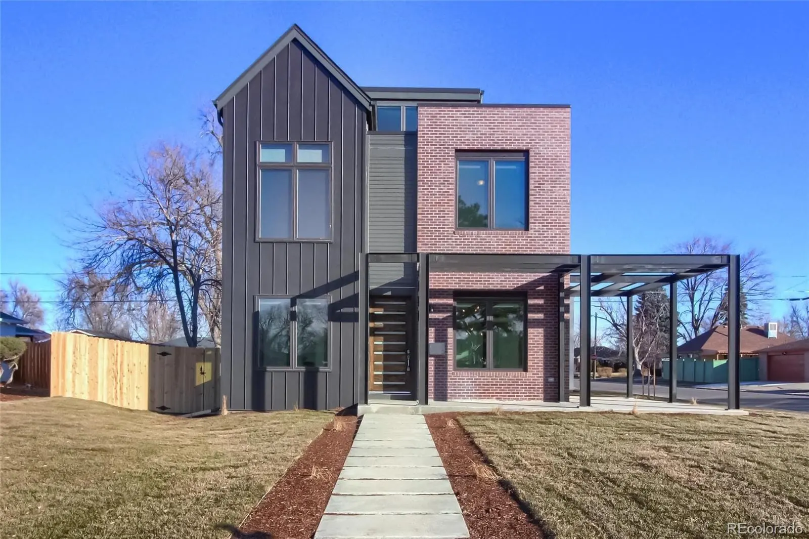 A front view of a house with a yard at 3000 Glencoe Street