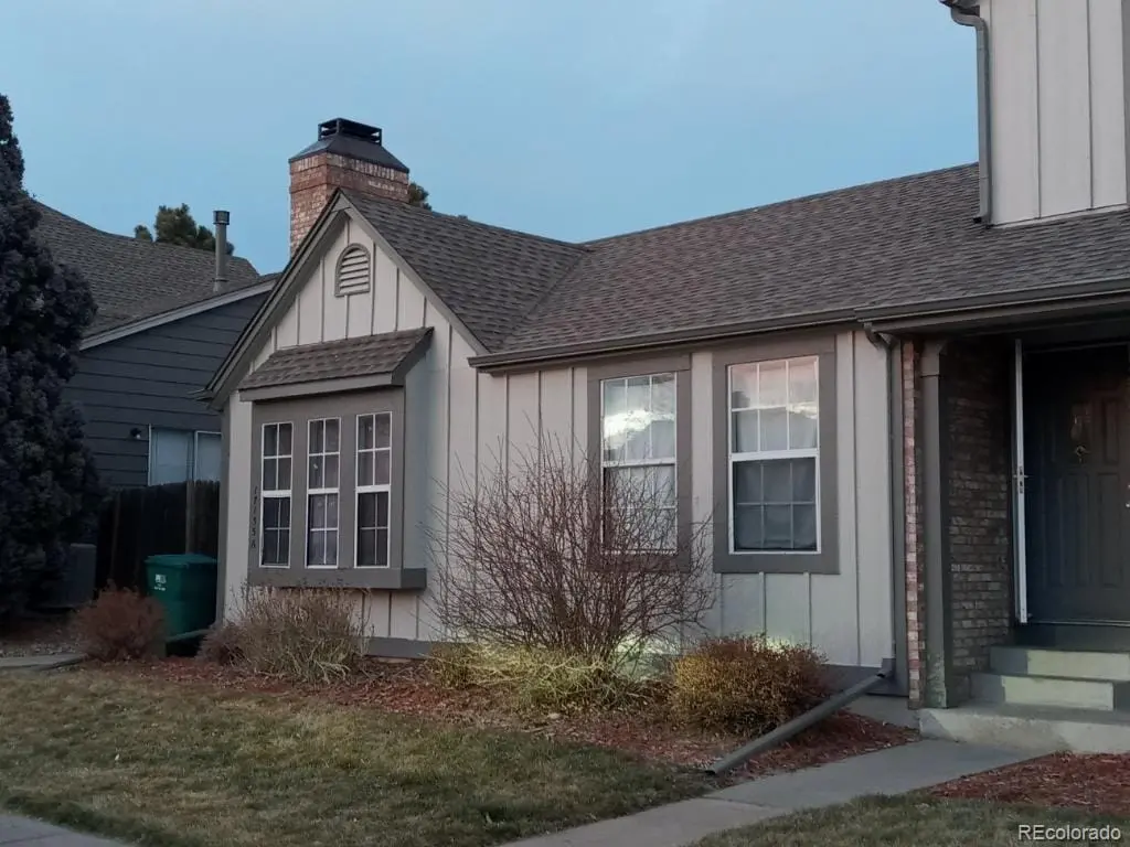 A front view of a house with garden at 17155 East Chenango Avenue, Unit A