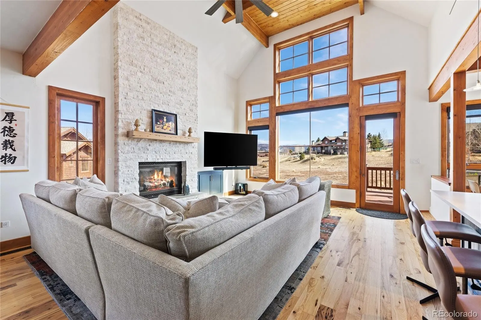 A living room with fireplace furniture and a flat screen tv at 22 Callie Clark Court