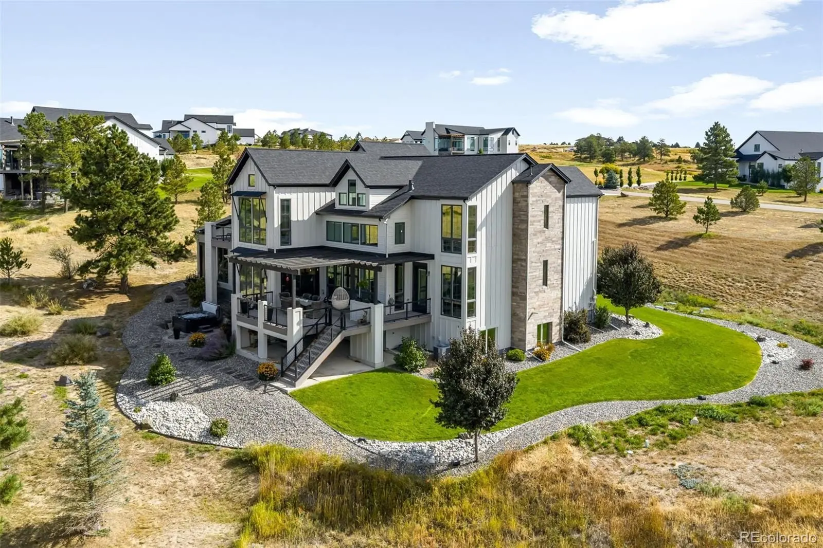 A view of a house with outdoor space and sitting area at 8203 Merryvale Trail