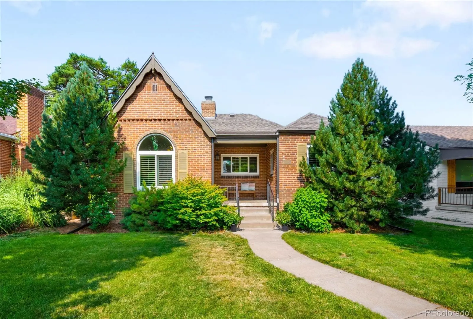 A view of a house with a yard at 3065 Clermont Street