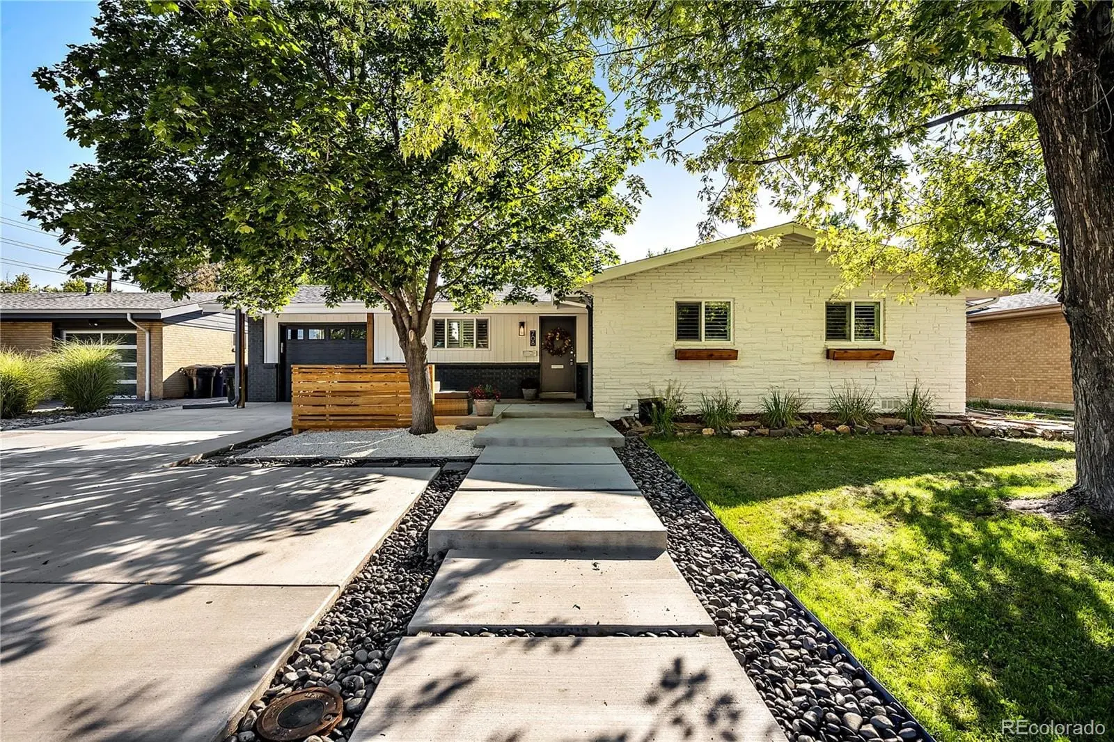 A view of a yard with plants and trees at 708 South Grape Street
