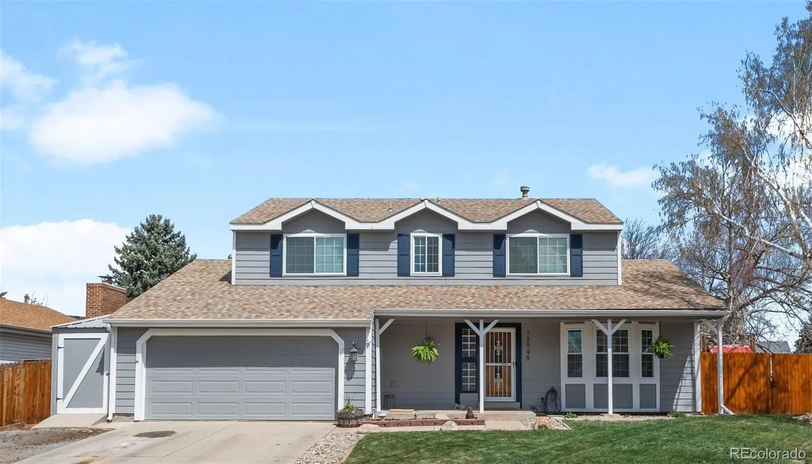 A front view of a house with a yard at 12945 East Colorado Avenue