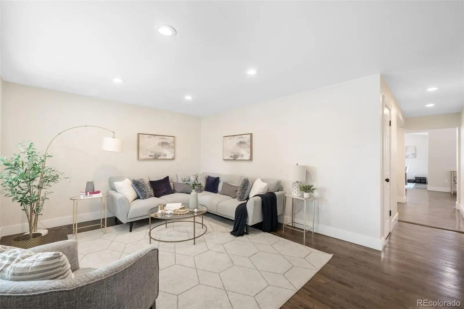 A living room with furniture and wooden floor at 7901 Maria Street