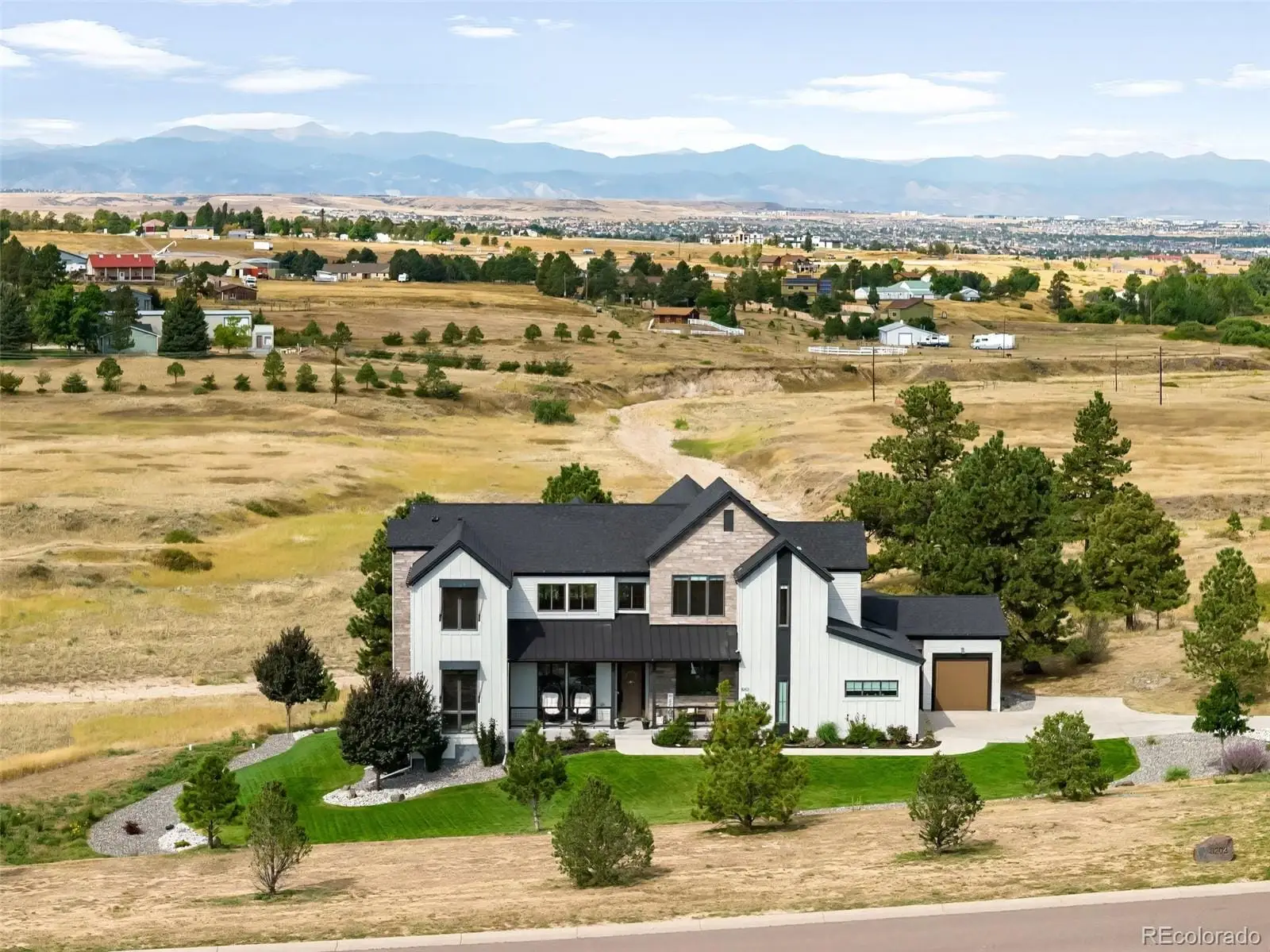 A front view of a building with a ocean view at 8203 Merryvale Trail
