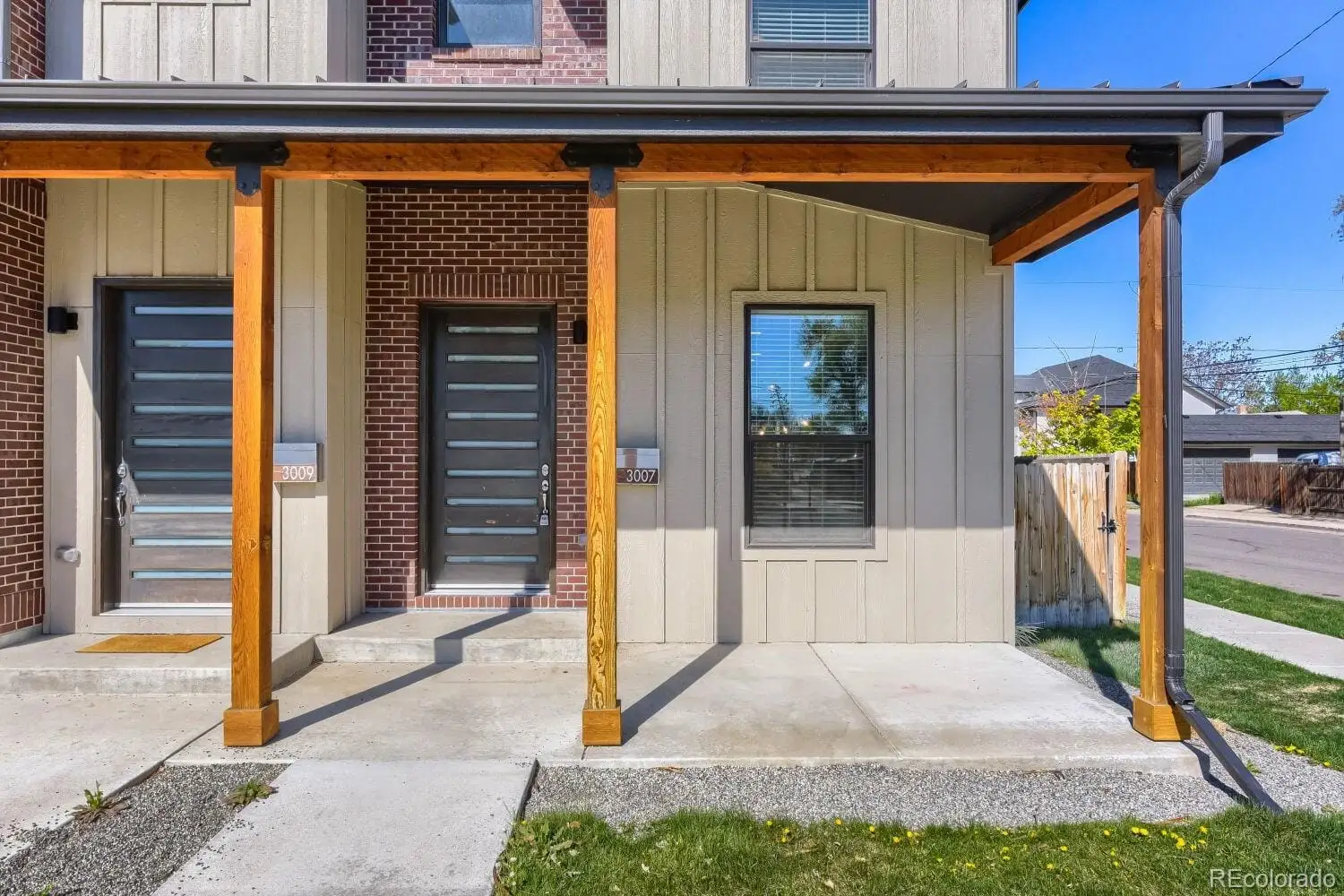 A front view of a house with a porch at 3007 South Cherokee Street