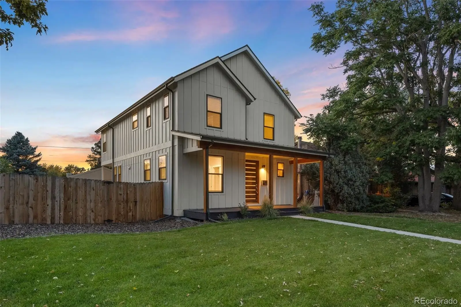 A front view of house with yard and green space at 2865 Holly Street