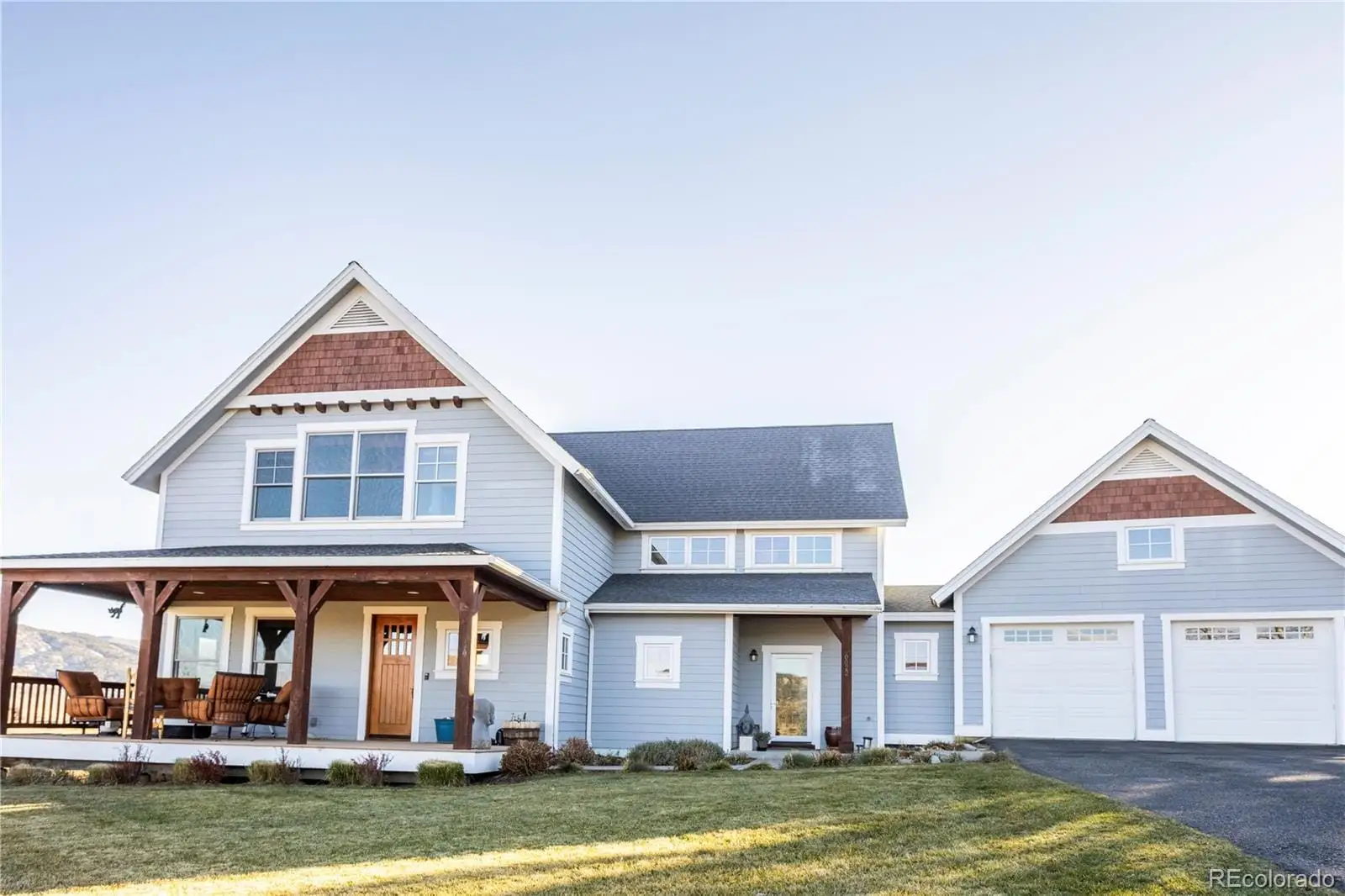 A front view of a house with a yard at 22 Callie Clark Court