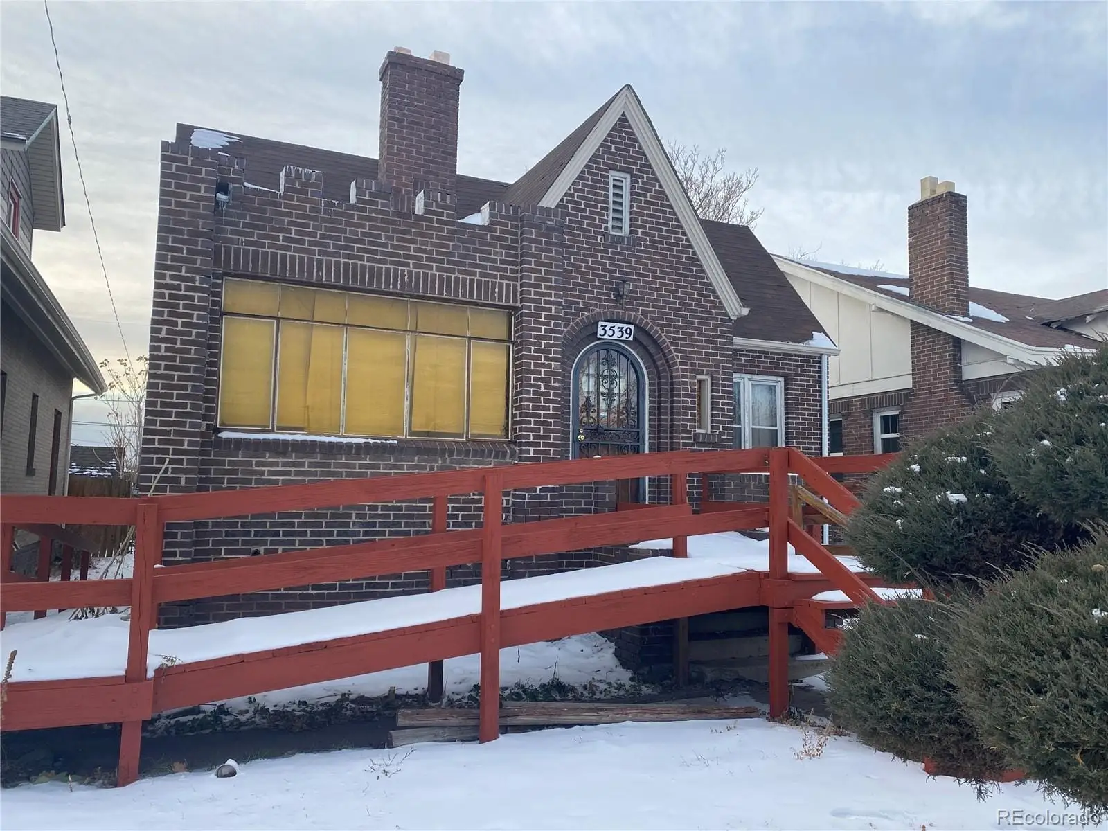 A front view of a house with a yard at 3539 Vine Street