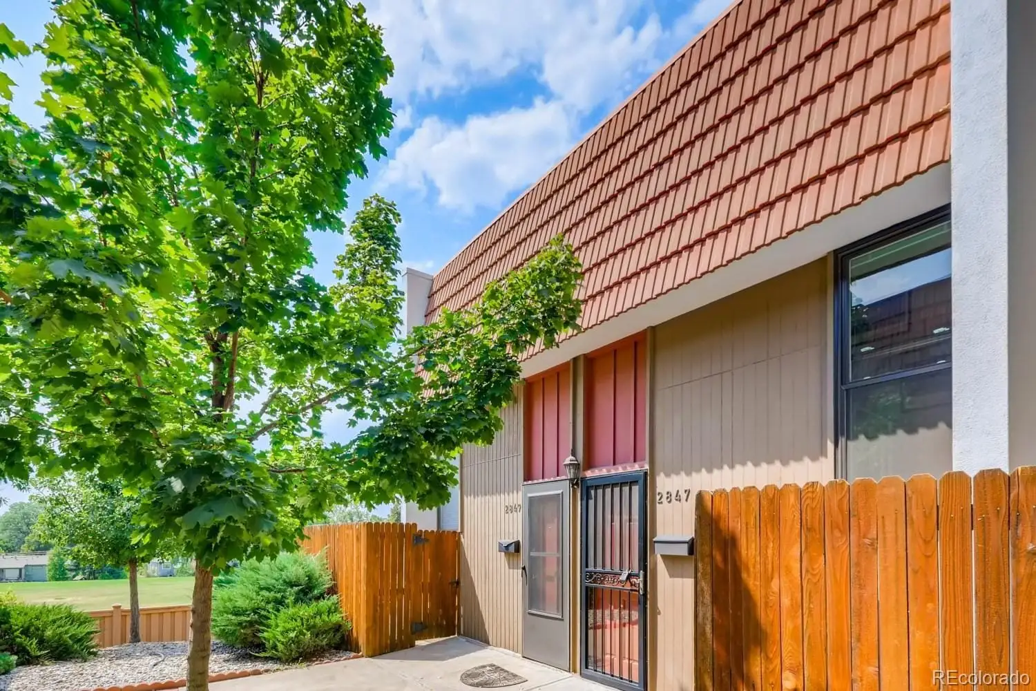 A view of a house with a backyard at 2847 South Locust Street