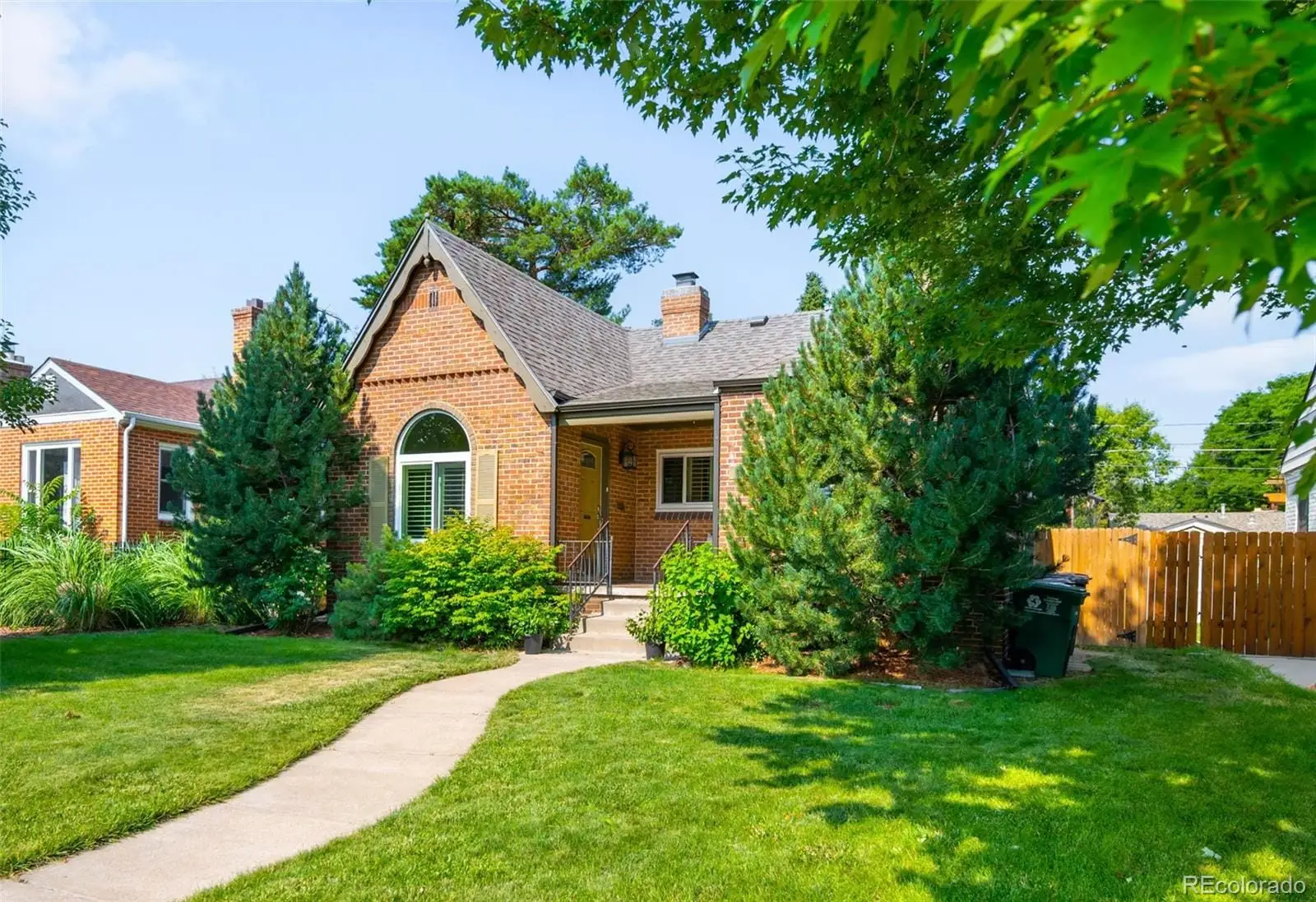 A front view of a house with a yard at 3065 Clermont Street