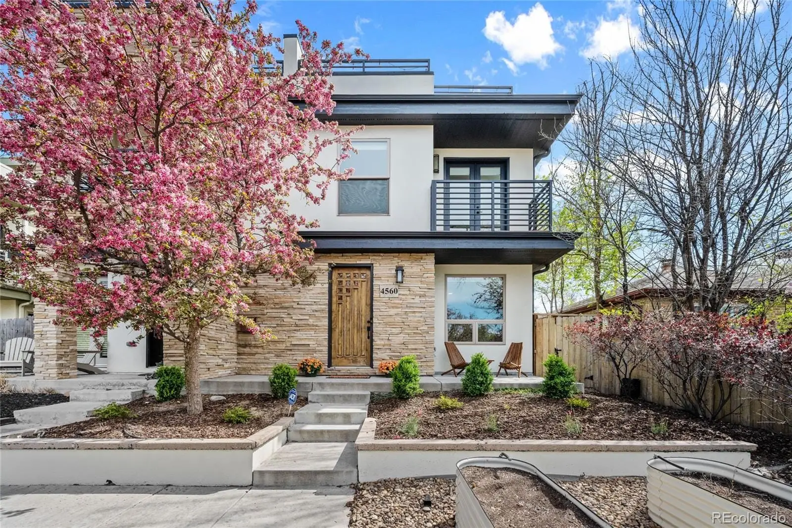 A front view of a house with garden at 4560 West 35th Avenue