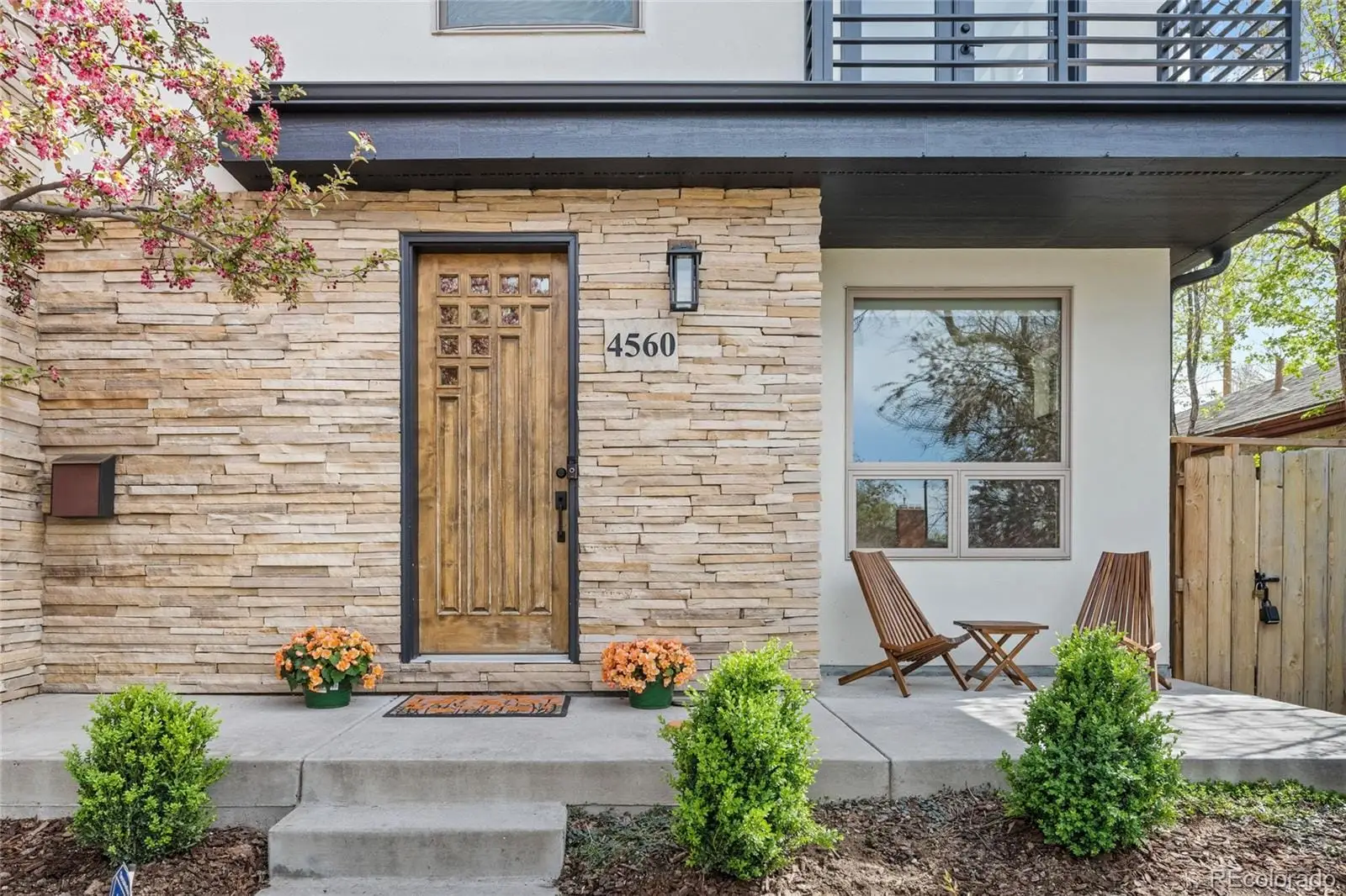 A front view of a house with a garden at 4560 West 35th Avenue