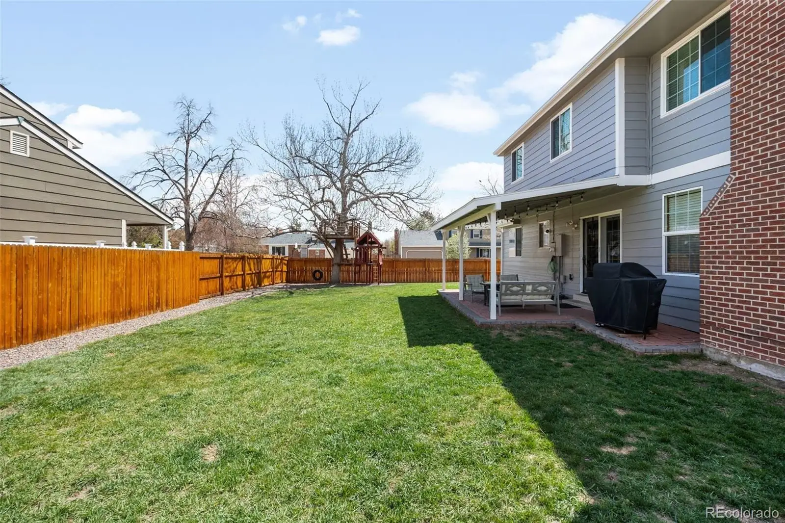 A view of a yard in front of house at 12945 East Colorado Avenue