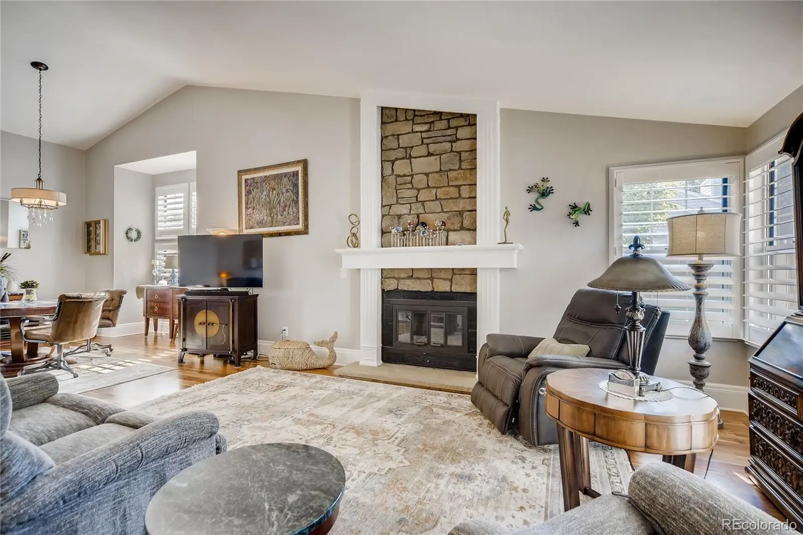 A living room with furniture and a fireplace at 7553 West Euclid Drive