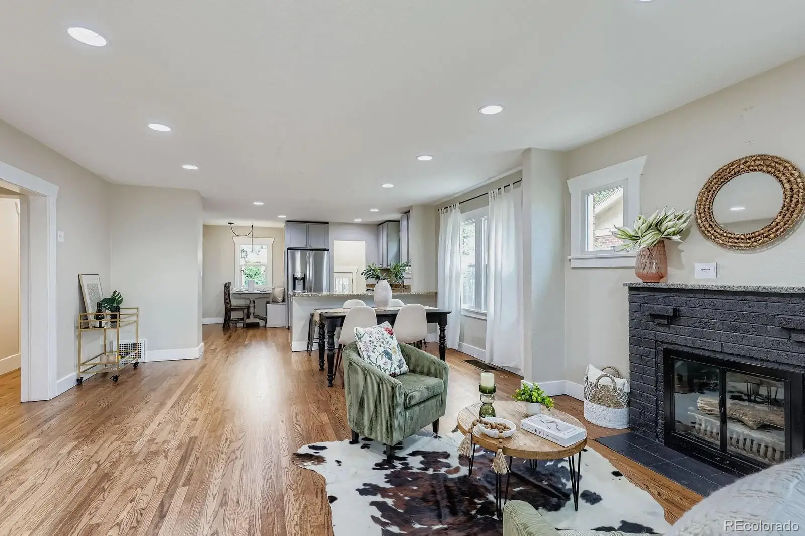 A living room with furniture a fireplace and wooden floor at 2026 South Lincoln Street