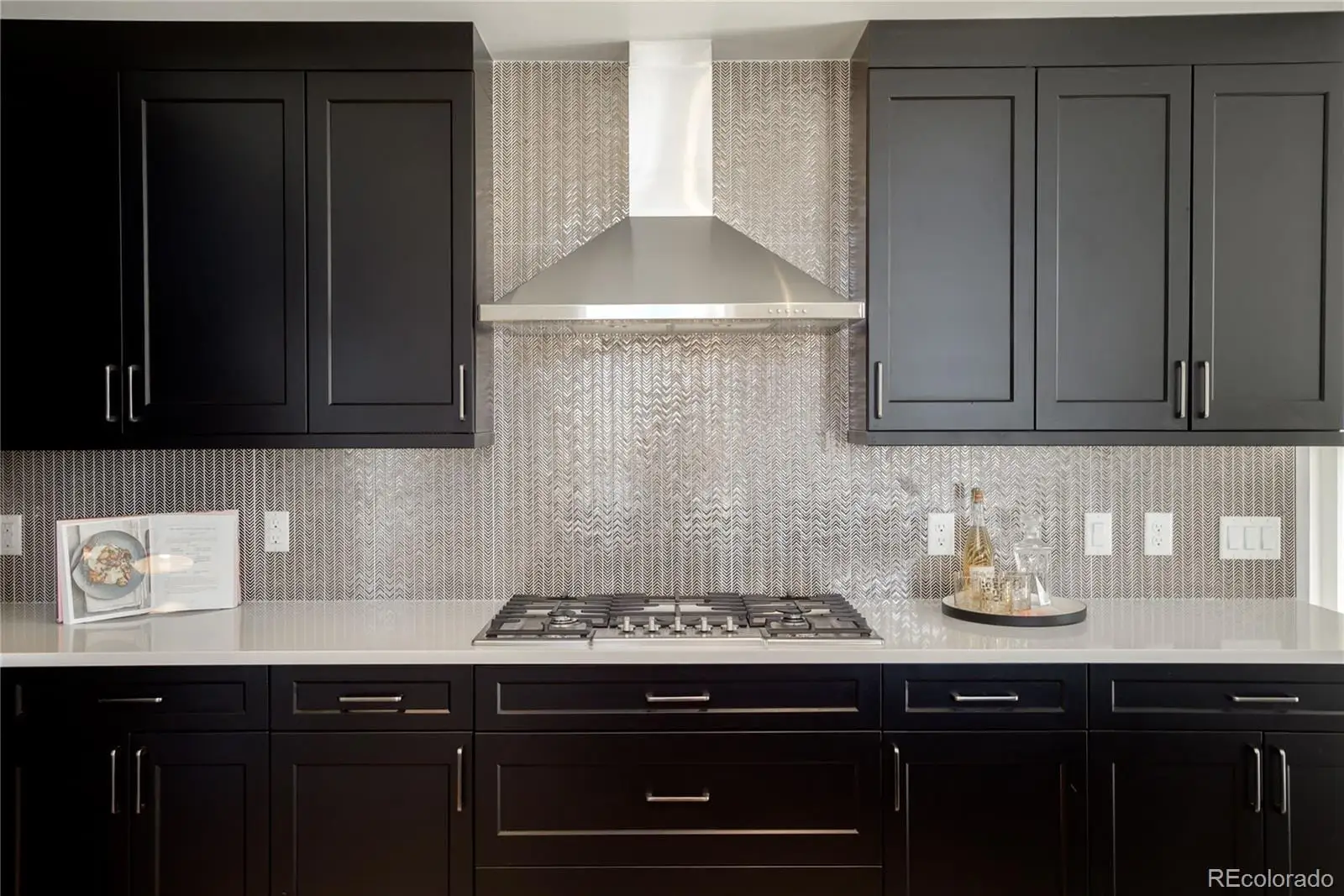 A kitchen with granite countertop cabinets and stainless steel appliances at 274 South Monroe Street, Unit 1002