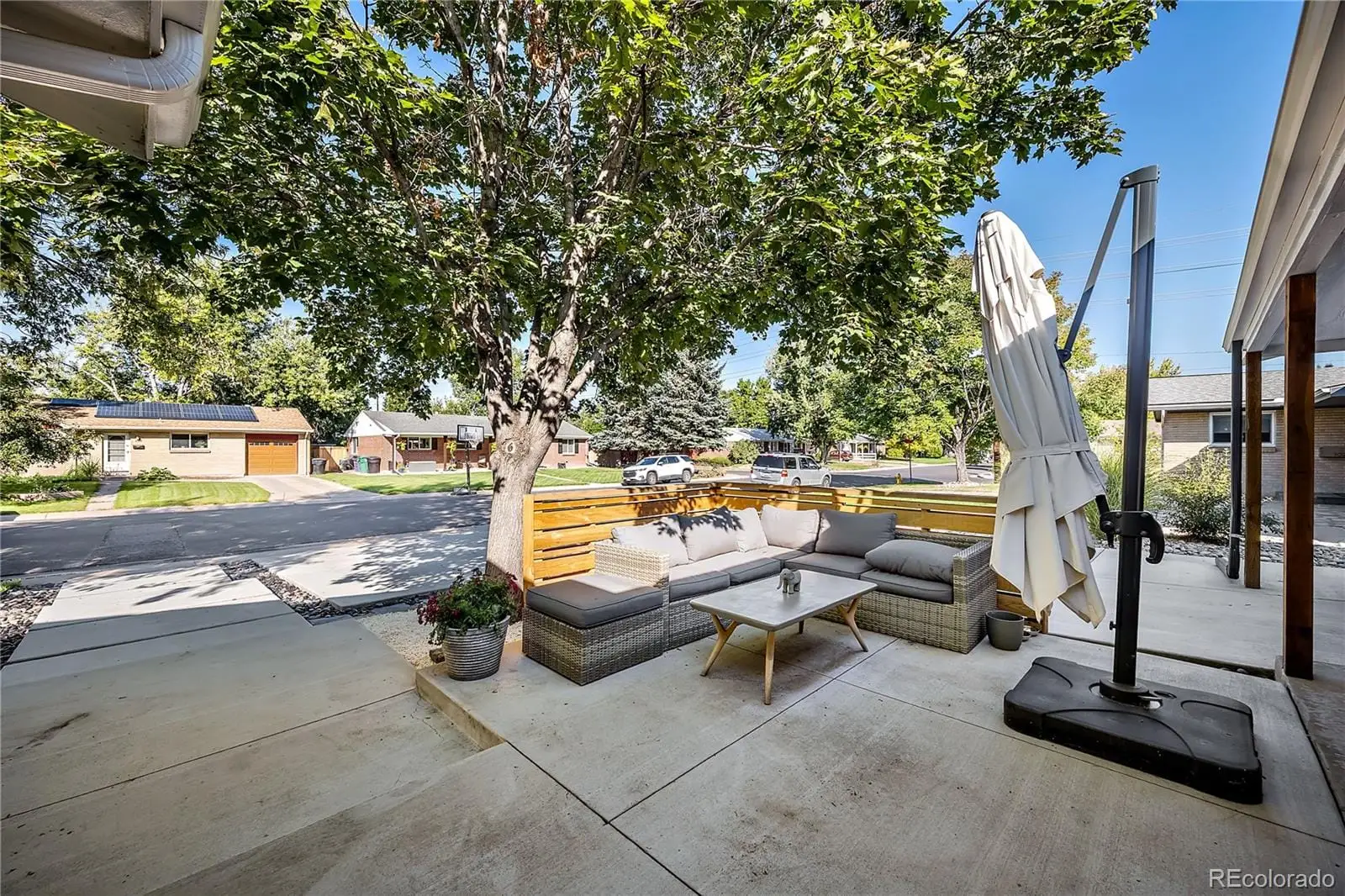 A view of a swimming pool with lounge chairs in patio at 708 South Grape Street
