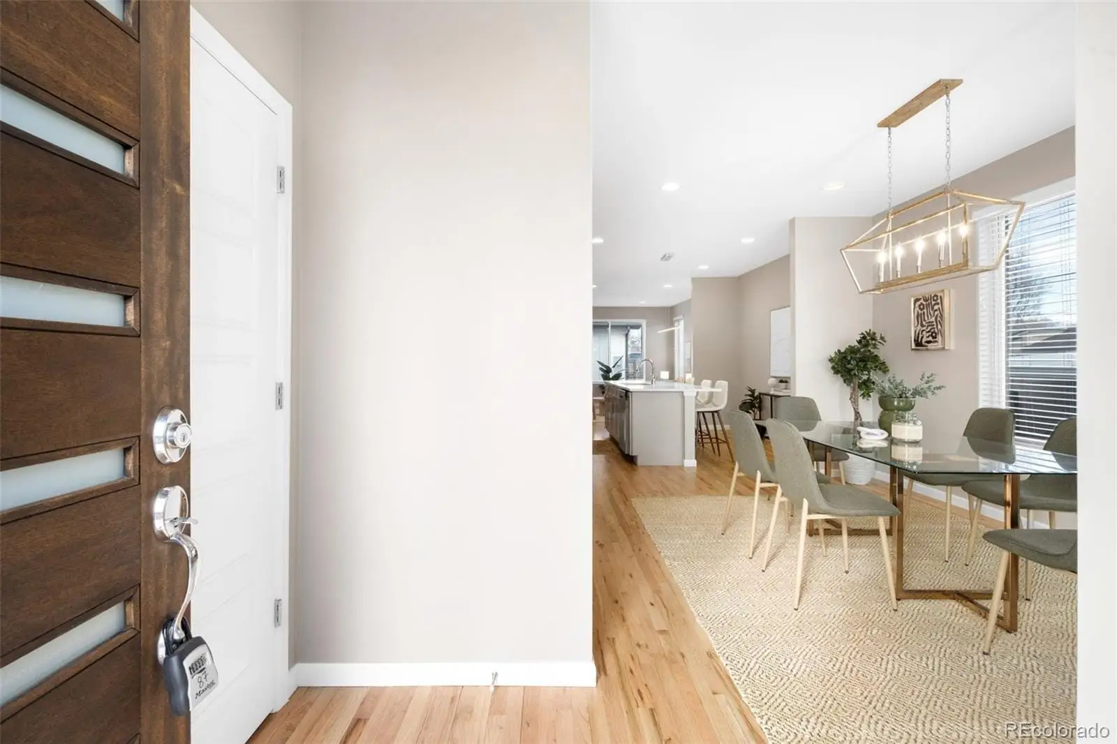 A view of a dining room with furniture window and wooden floor at 1039 Julian Street