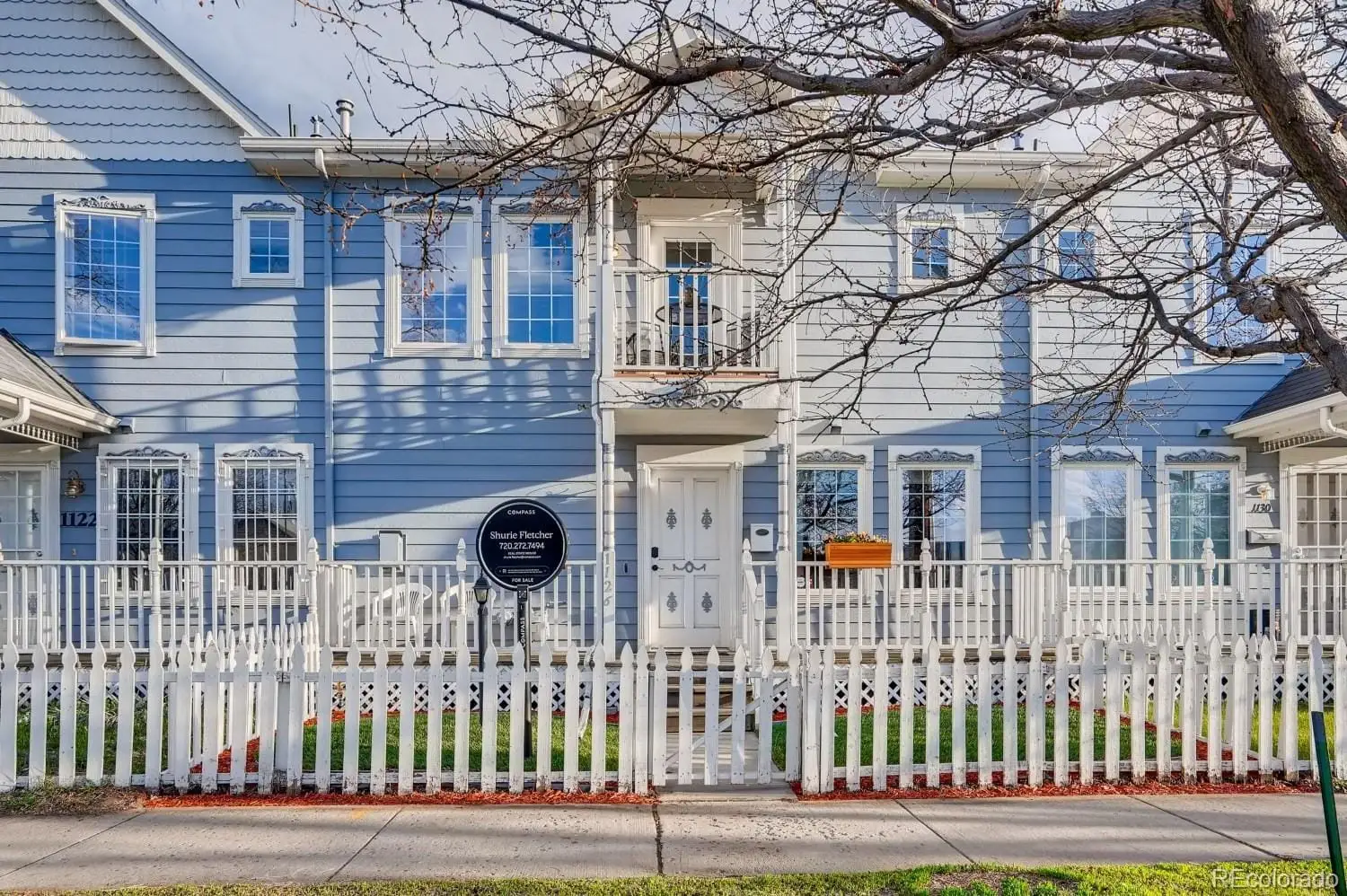 A view of a brick house with a iron fence at 1126 West 10th Avenue