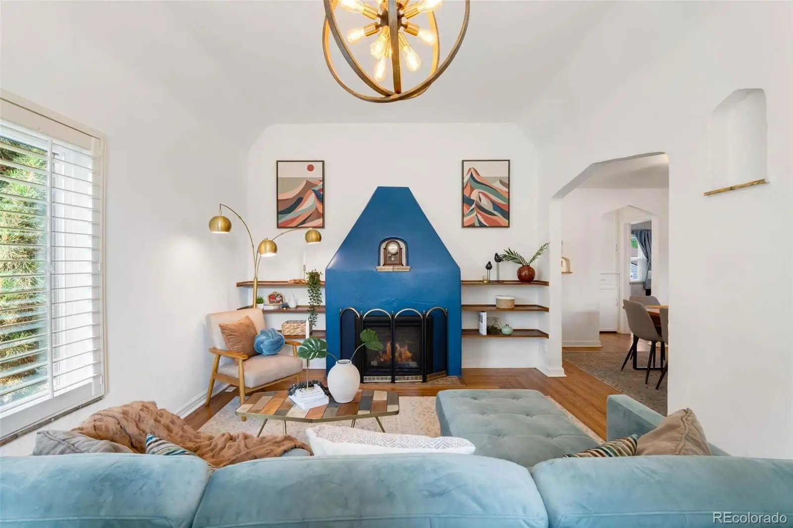 A living room with furniture a window and a fireplace at 3065 Clermont Street