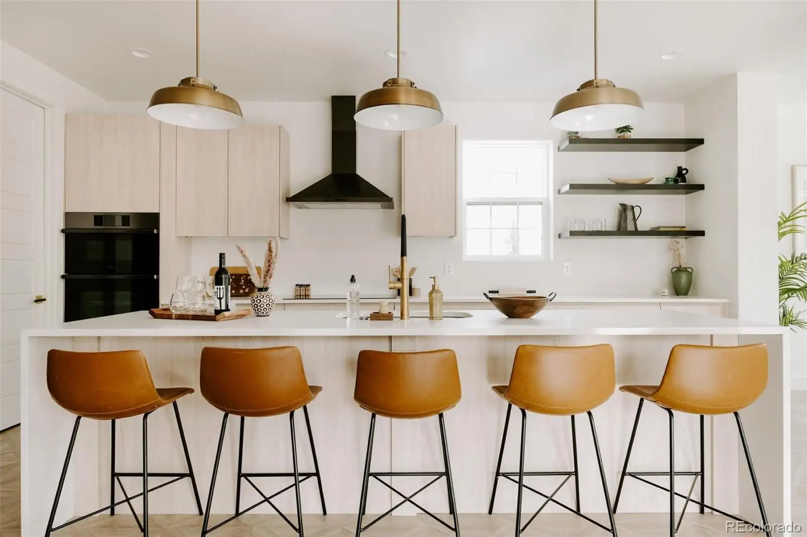 A kitchen with a dining table and chairs at 1076 Jasmine Street