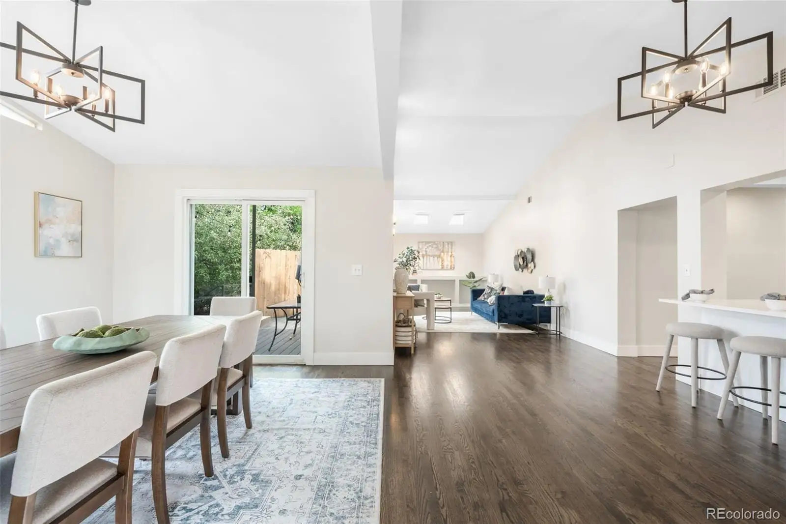 A view of a dining room with furniture window and wooden floor at 7901 Maria Street