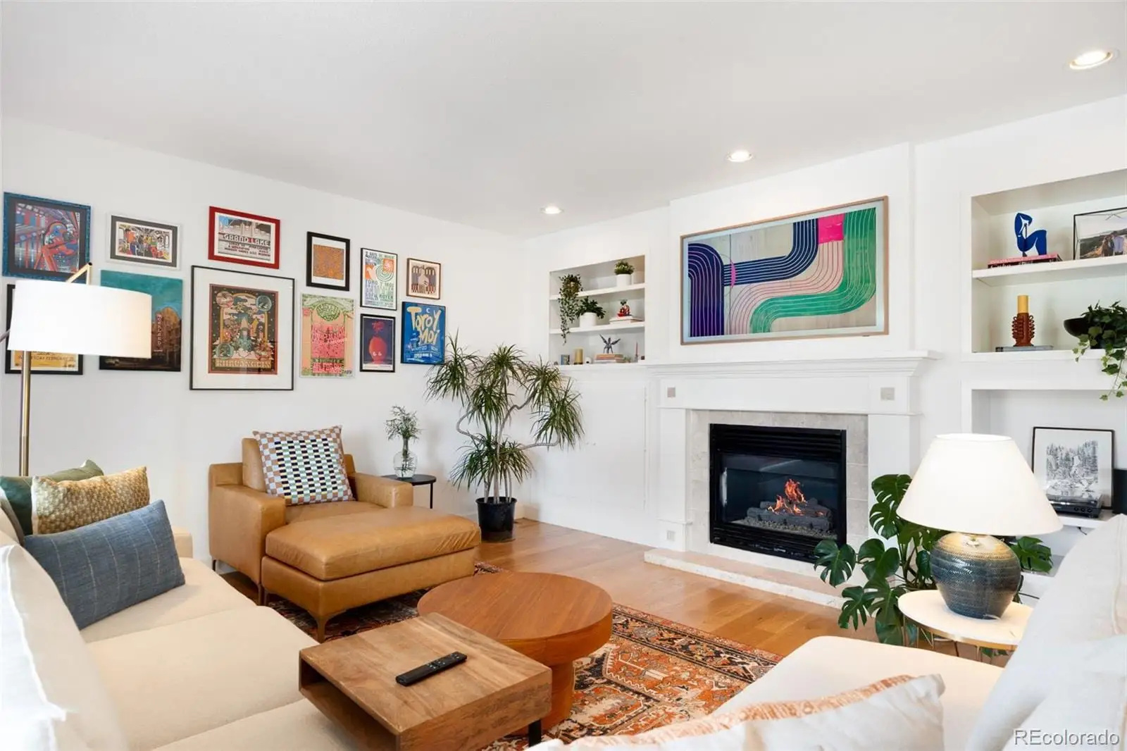 A living room with furniture and a fireplace at 234 South Madison Street, Unit H