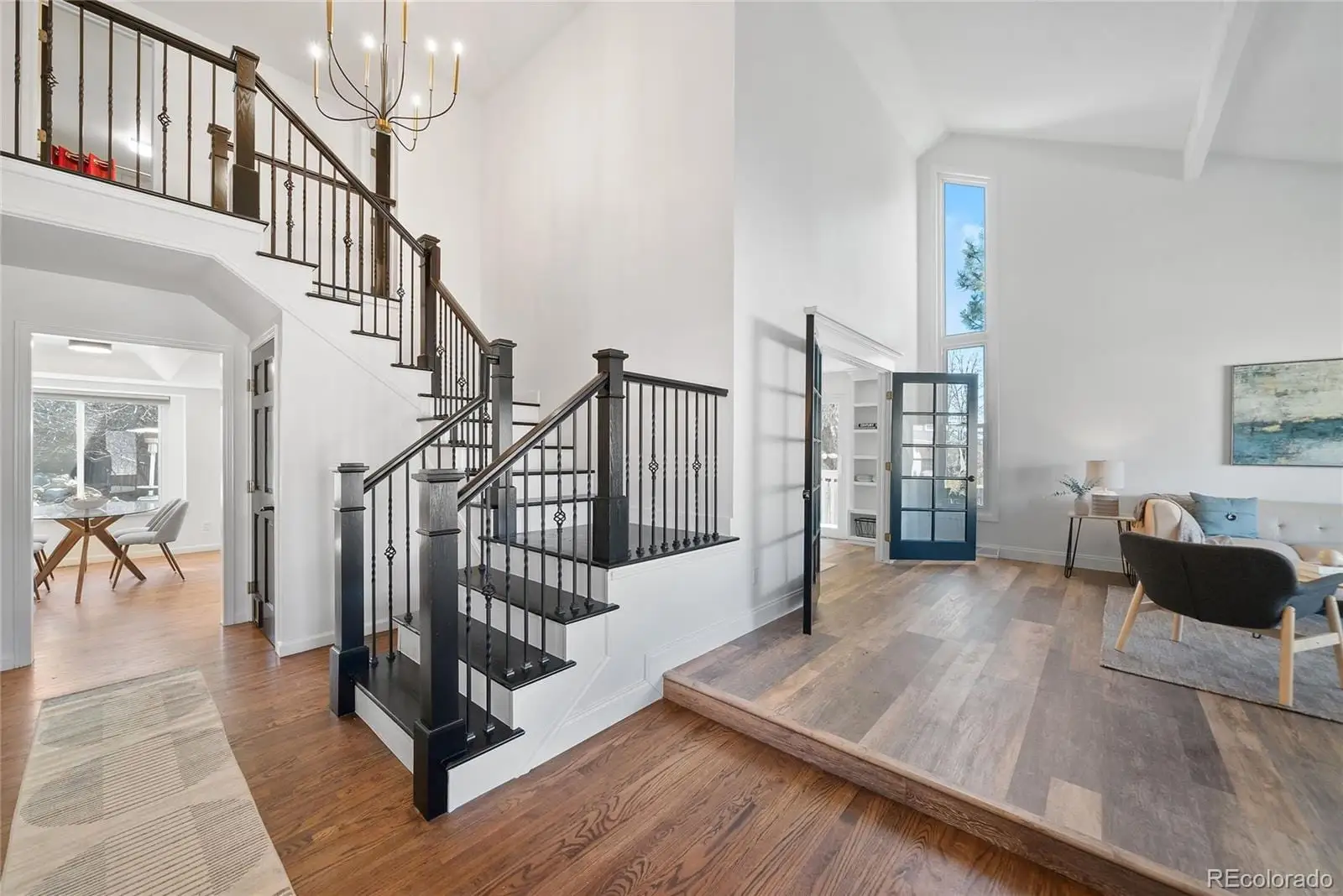 A view of entryway and hall with wooden floor at 8876 East Phillips Place