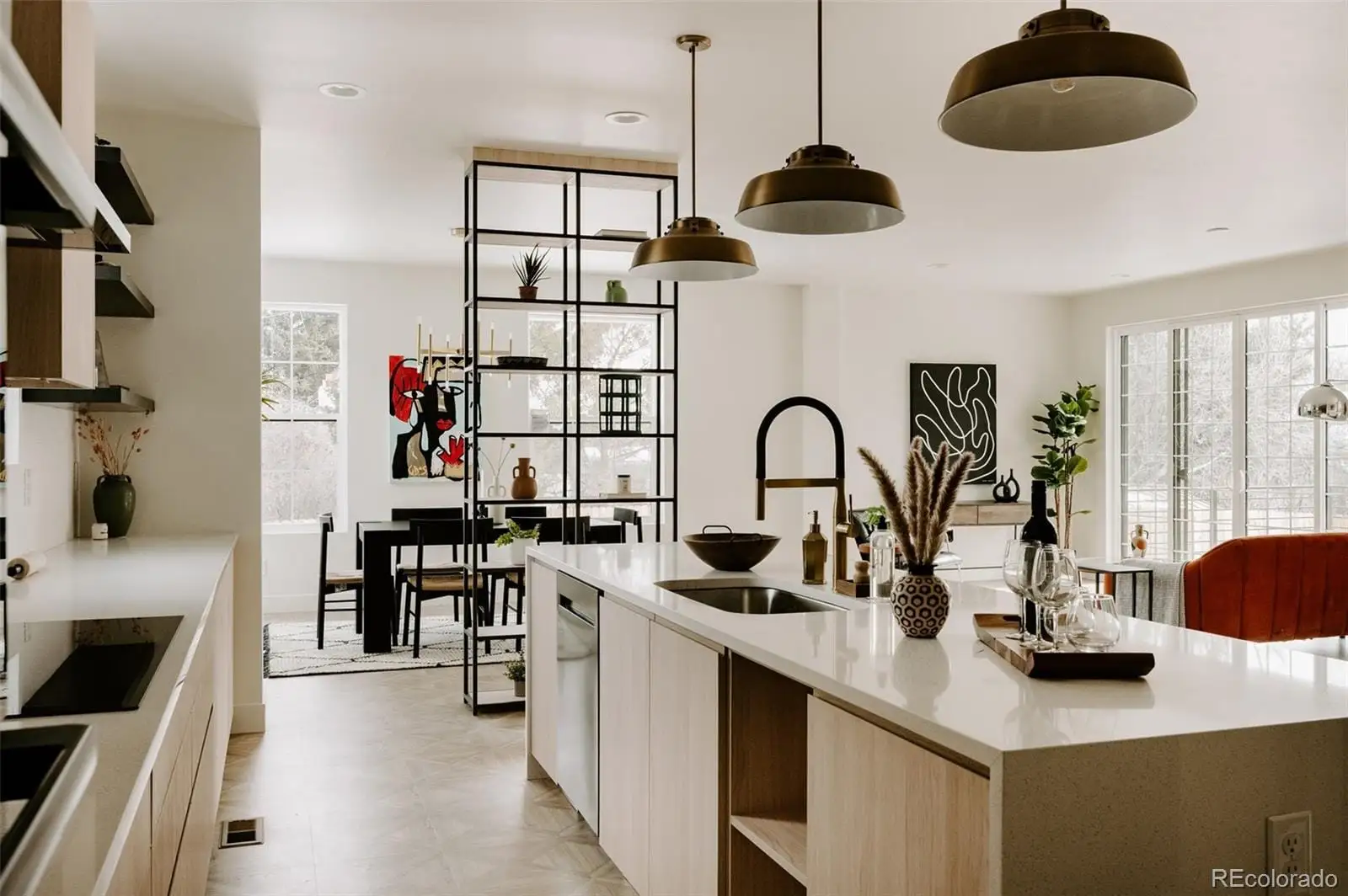 A kitchen with appliances cabinets and a table at 1076 Jasmine Street