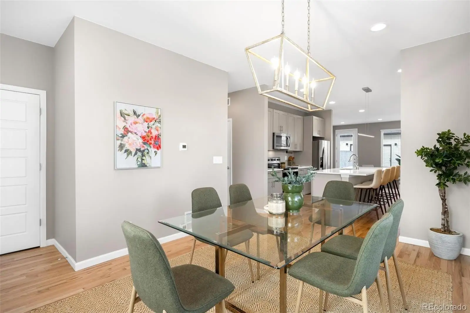 A view of a dining room with furniture and wooden floor at 1039 Julian Street