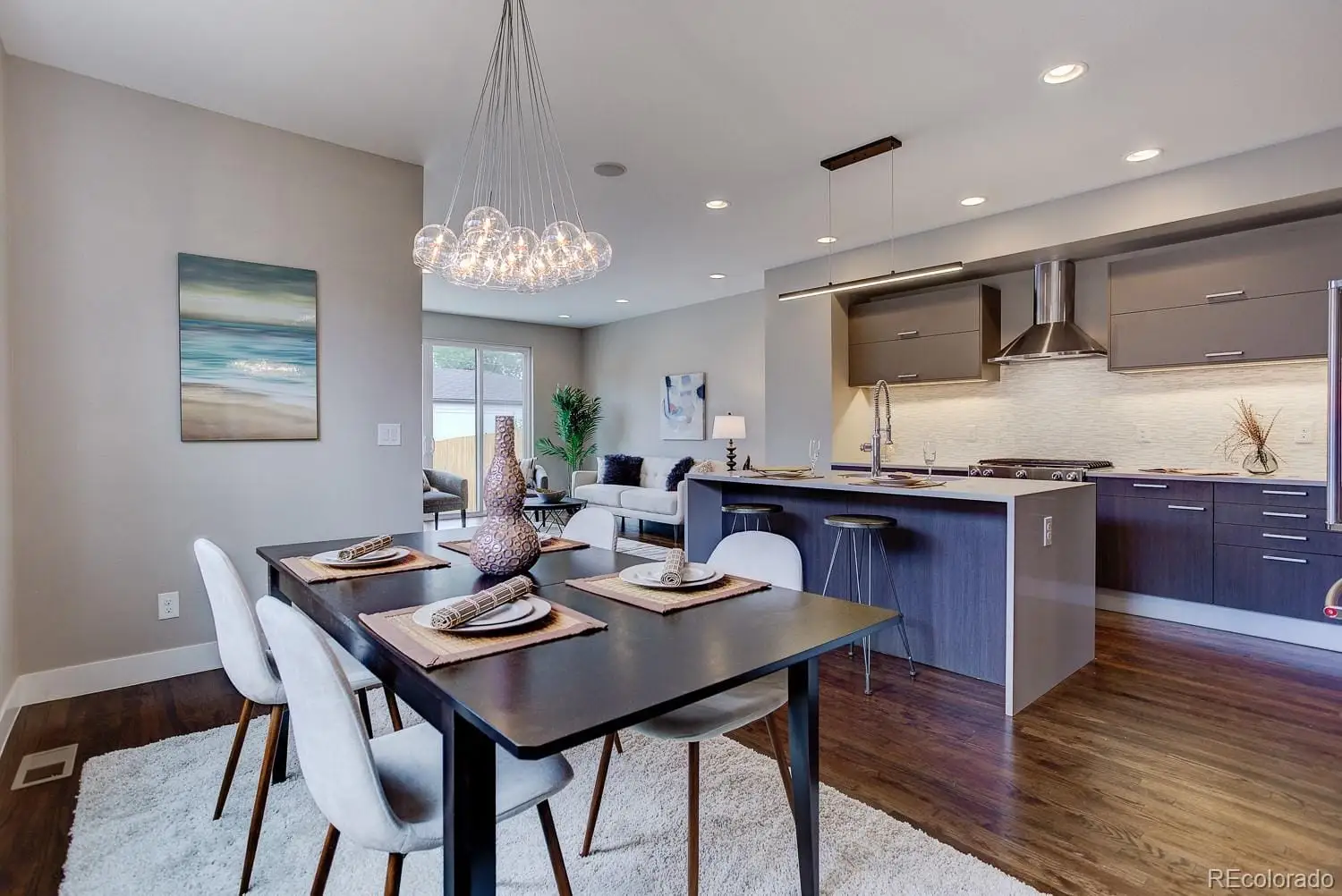 A view of a dining room with furniture window and wooden floor at 2851 South Cherokee Street