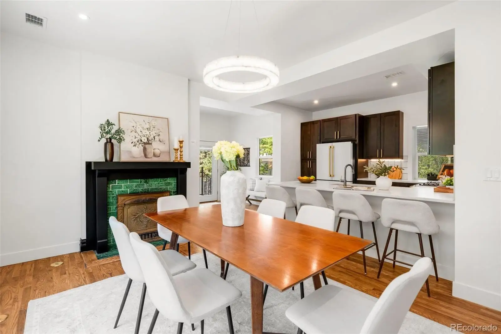 A dining room with furniture and wooden floor at 2343 Dahlia Street
