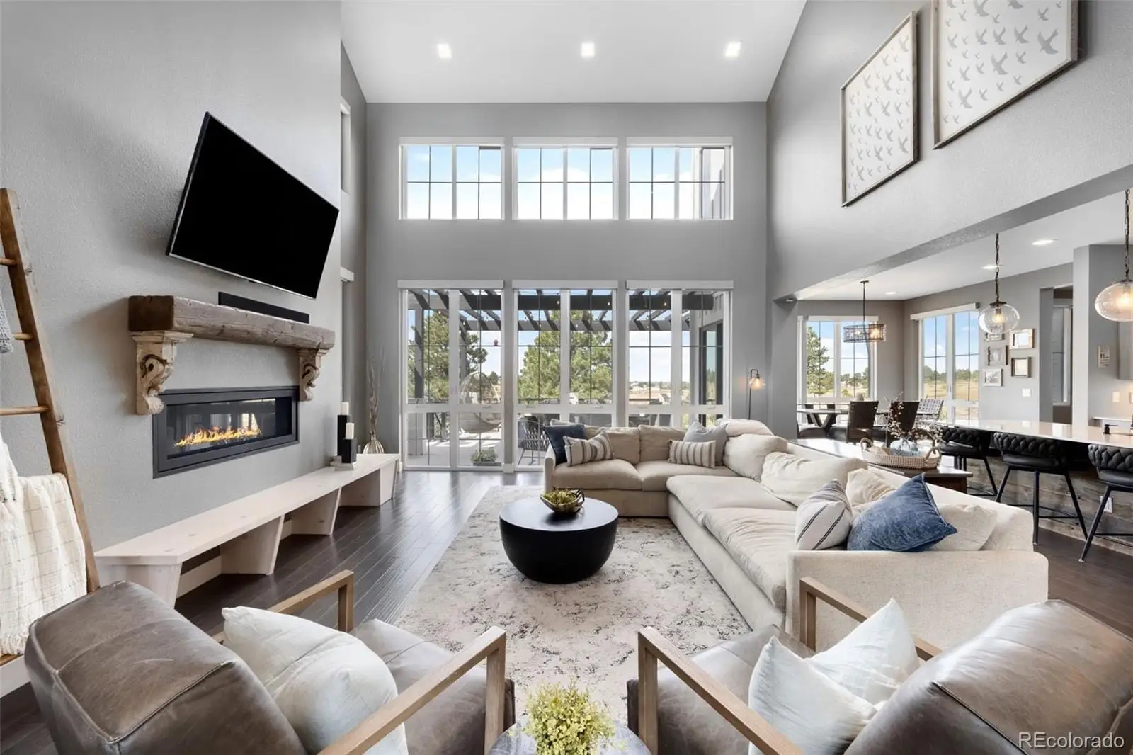 A living room with furniture and a flat screen tv at 8203 Merryvale Trail