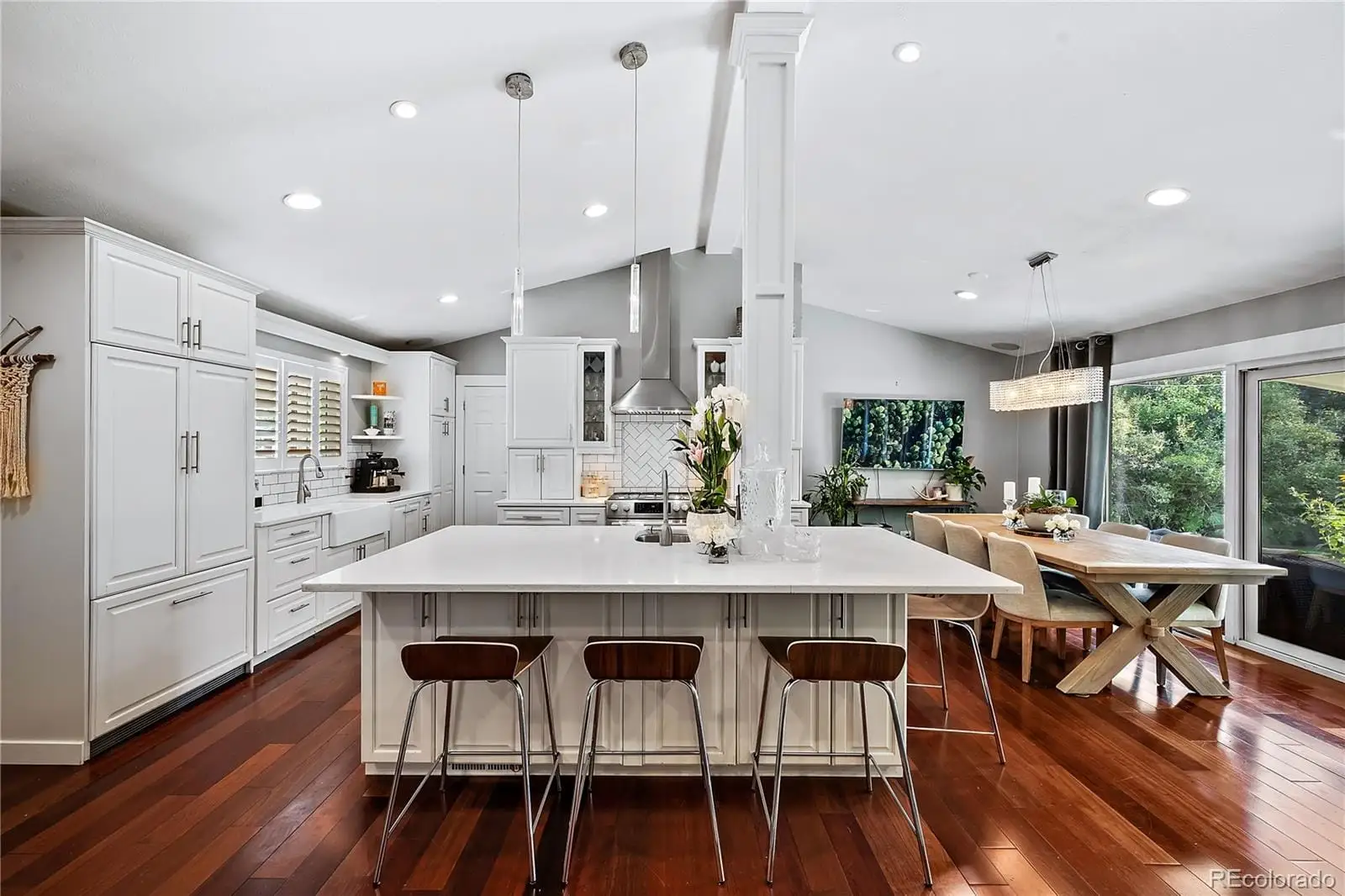 A view of a dining room with furniture window and wooden floor at 708 South Grape Street