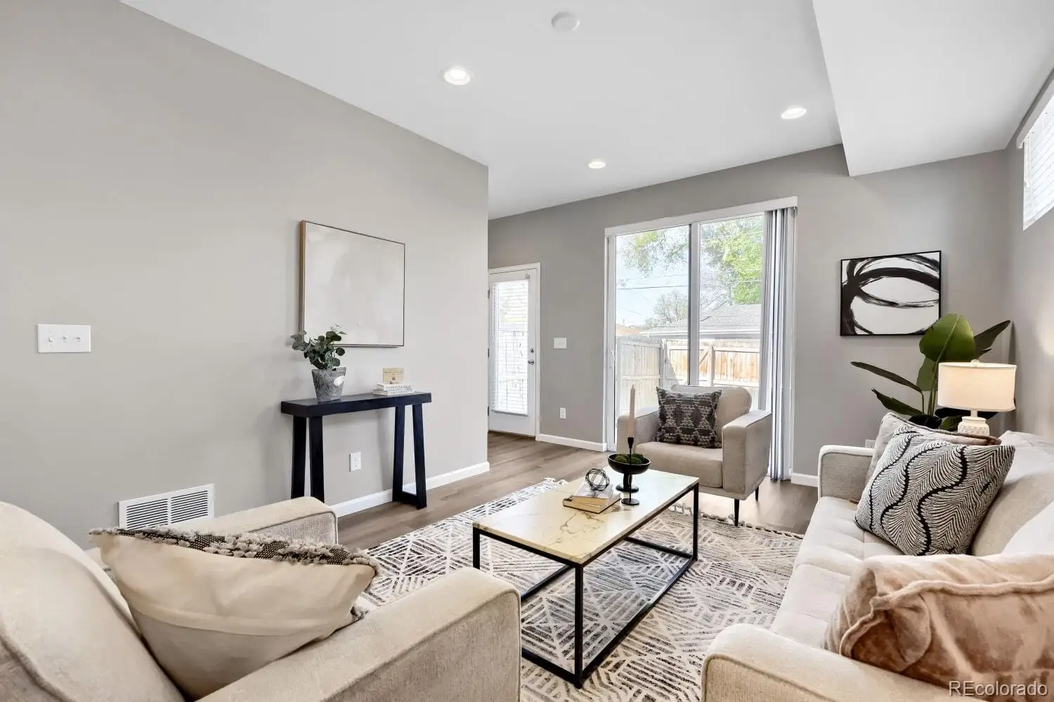 A living room with furniture and wooden floor at 3007 South Cherokee Street