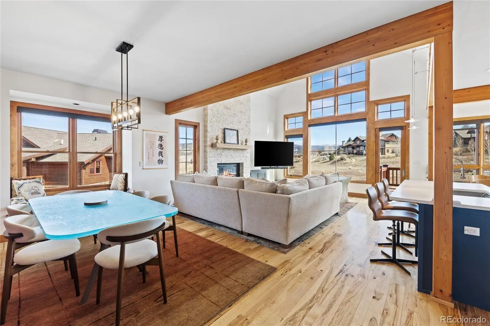 A living room with furniture a flat screen tv and a floor to ceiling window at 22 Callie Clark Court