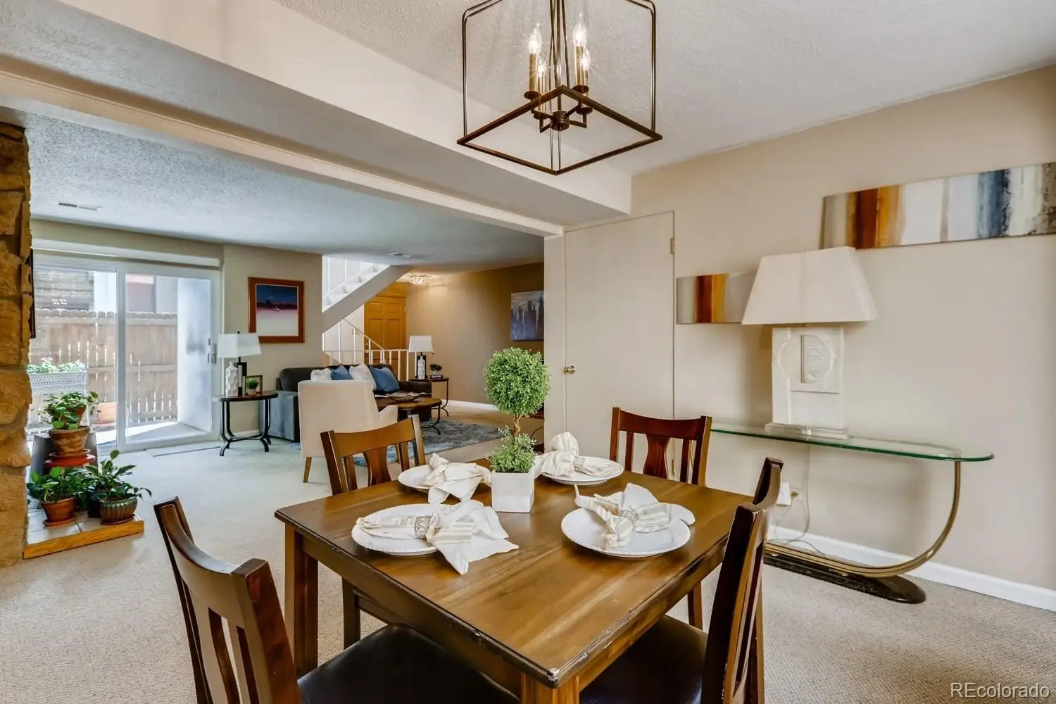 A view of a dining room with furniture and wooden floor at 2847 South Locust Street