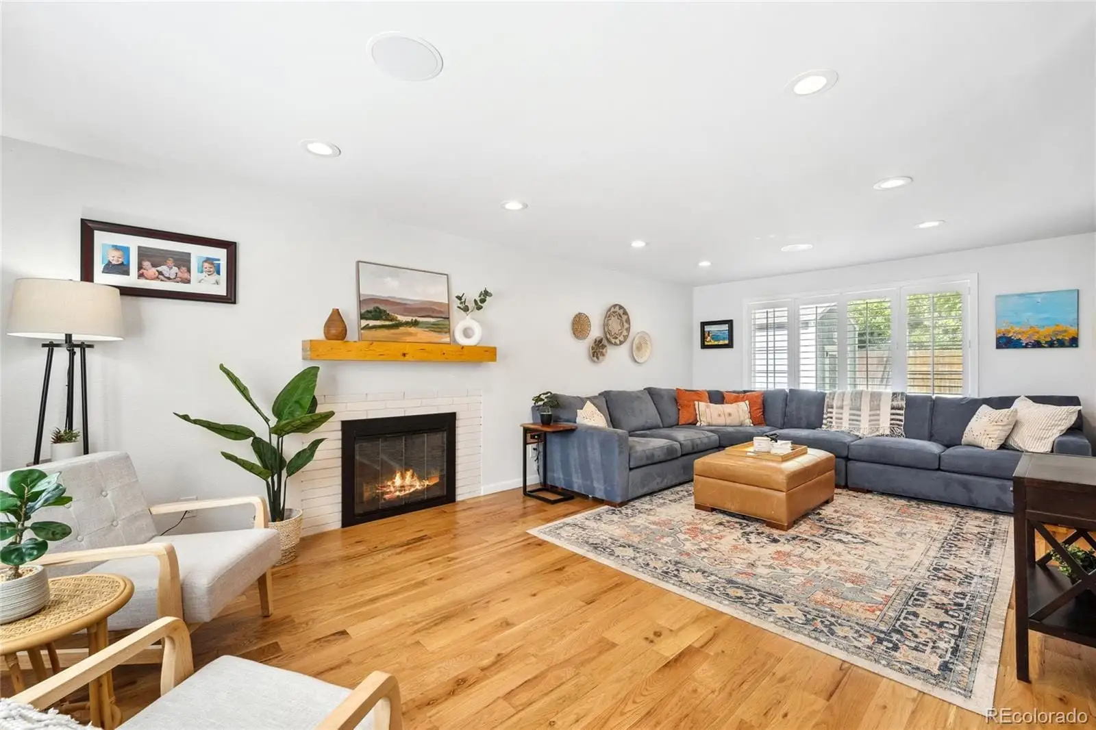 A living room with furniture and a fireplace at 1907 South Leyden Street