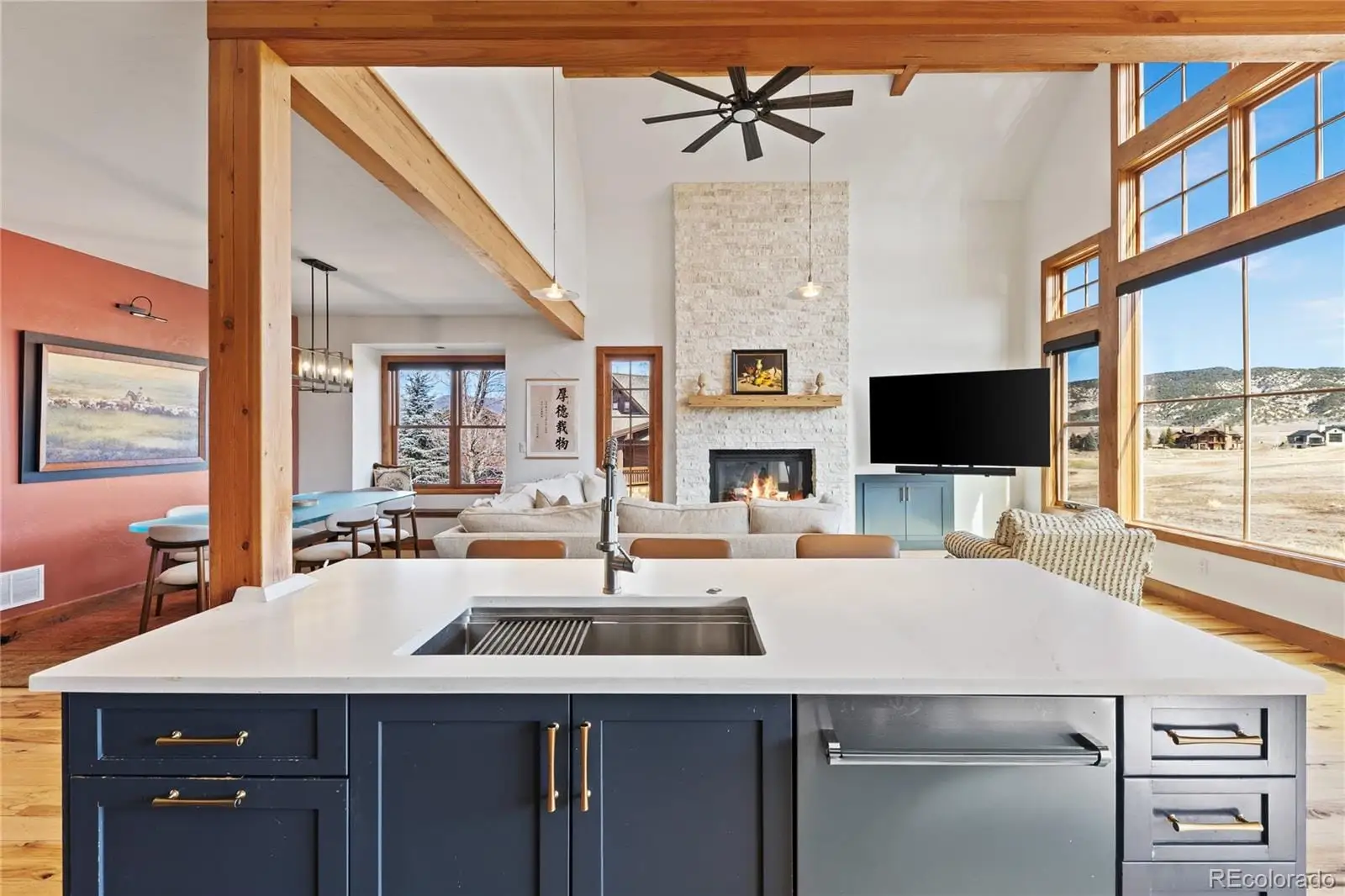 A view of a kitchen with kitchen island a sink appliances and a counter top space at 22 Callie Clark Court