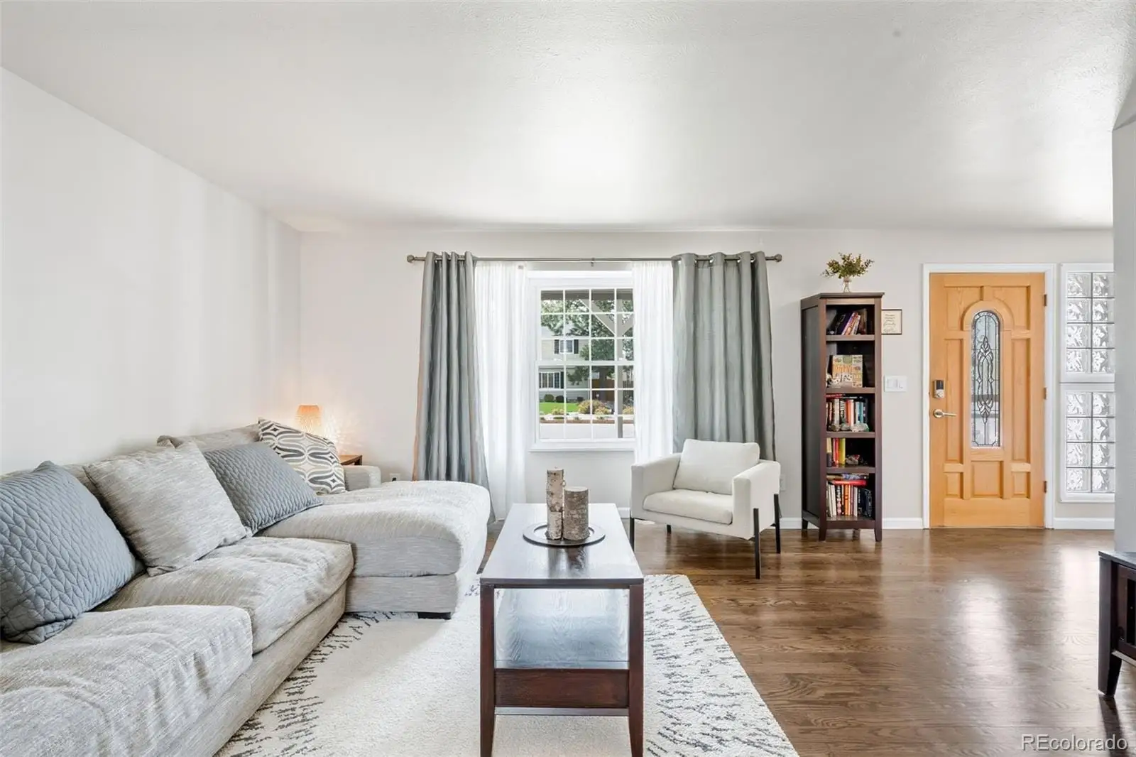 A living room with furniture and wooden floor at 12945 East Colorado Avenue