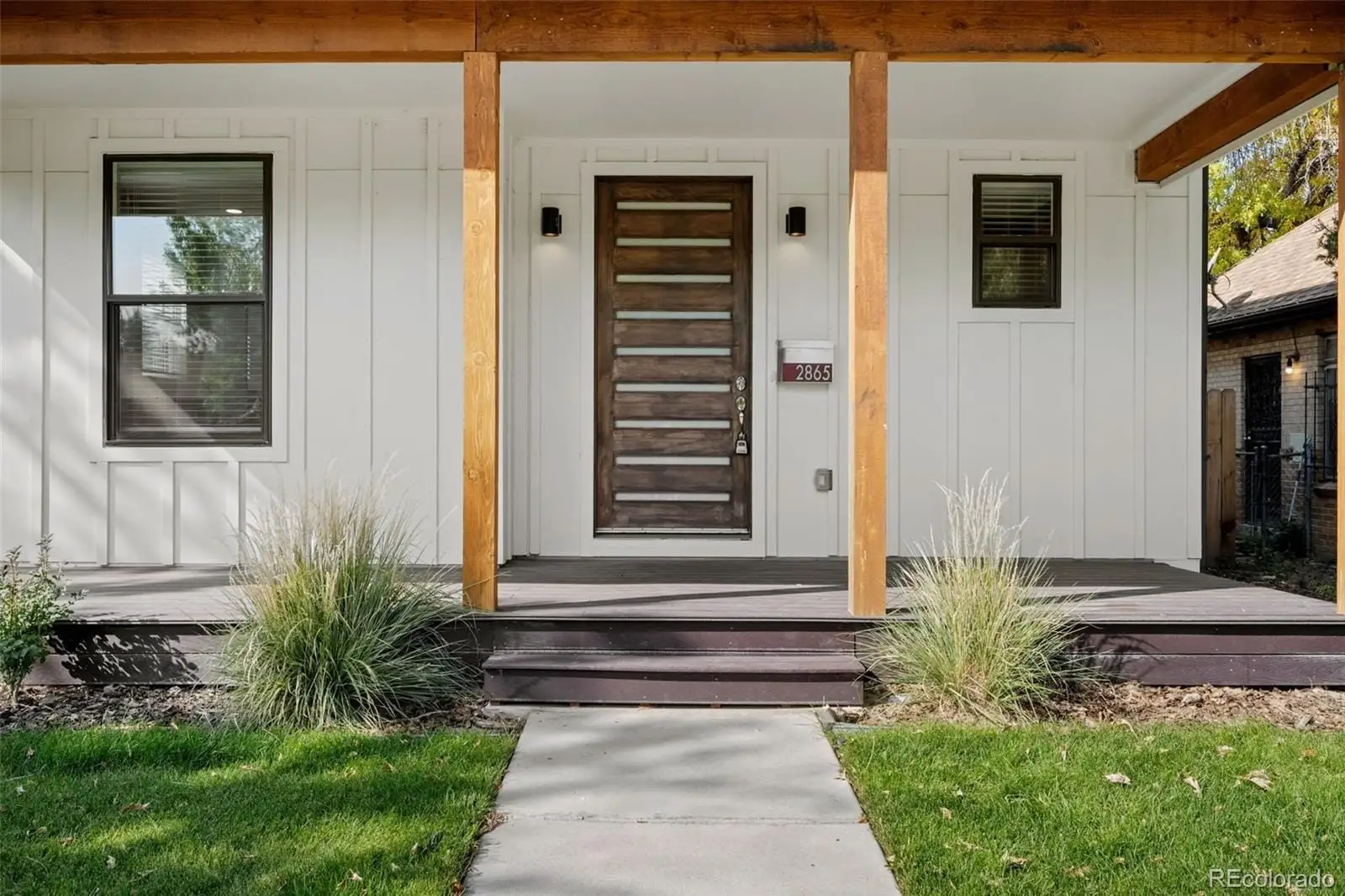 A front view of a house with a yard at 2865 Holly Street