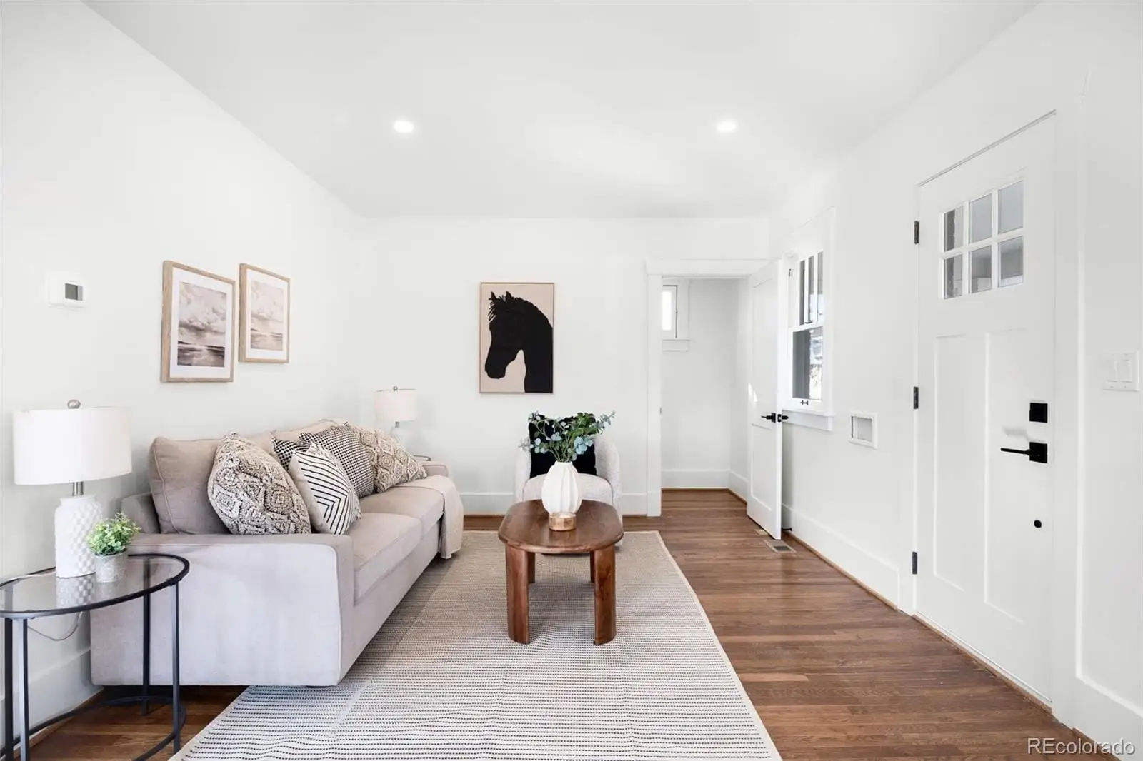 A living room with furniture and white walls at 2835 Cherry Street