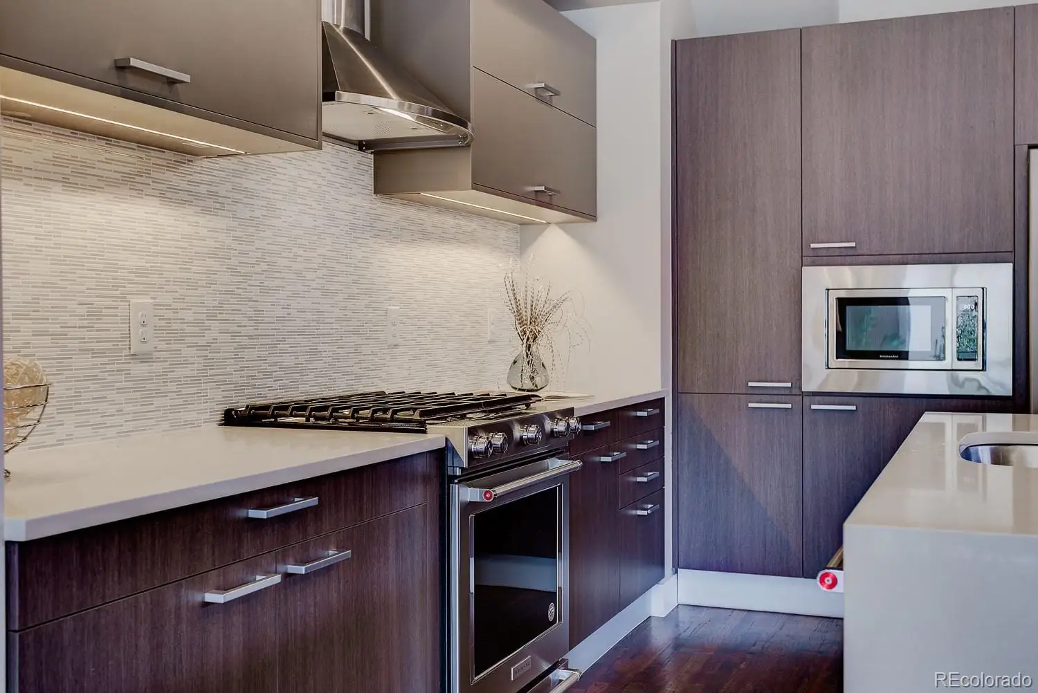 A kitchen with a stove and a microwave at 2851 South Cherokee Street