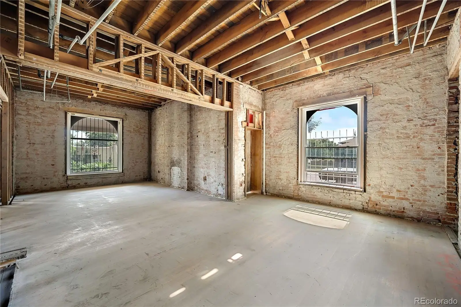 A view of an empty room with a fireplace at 2511 North Gaylord Street