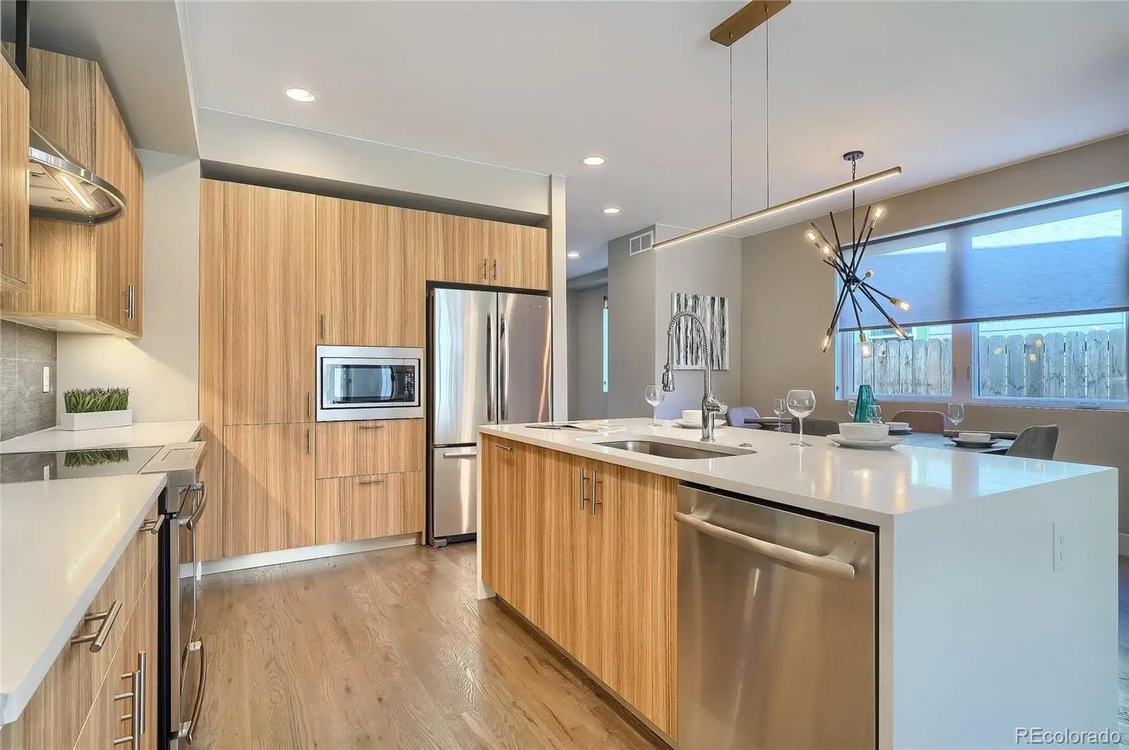 A kitchen with refrigerator and cabinets at 2843 South Acoma Street