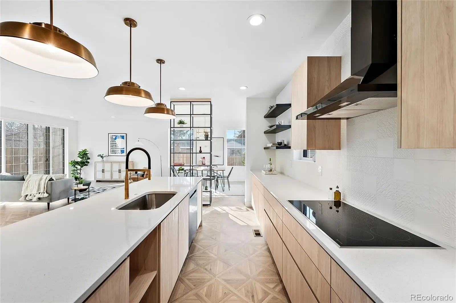 A kitchen with stainless steel appliances a sink a counter space and a window at 3217 South Elm Street