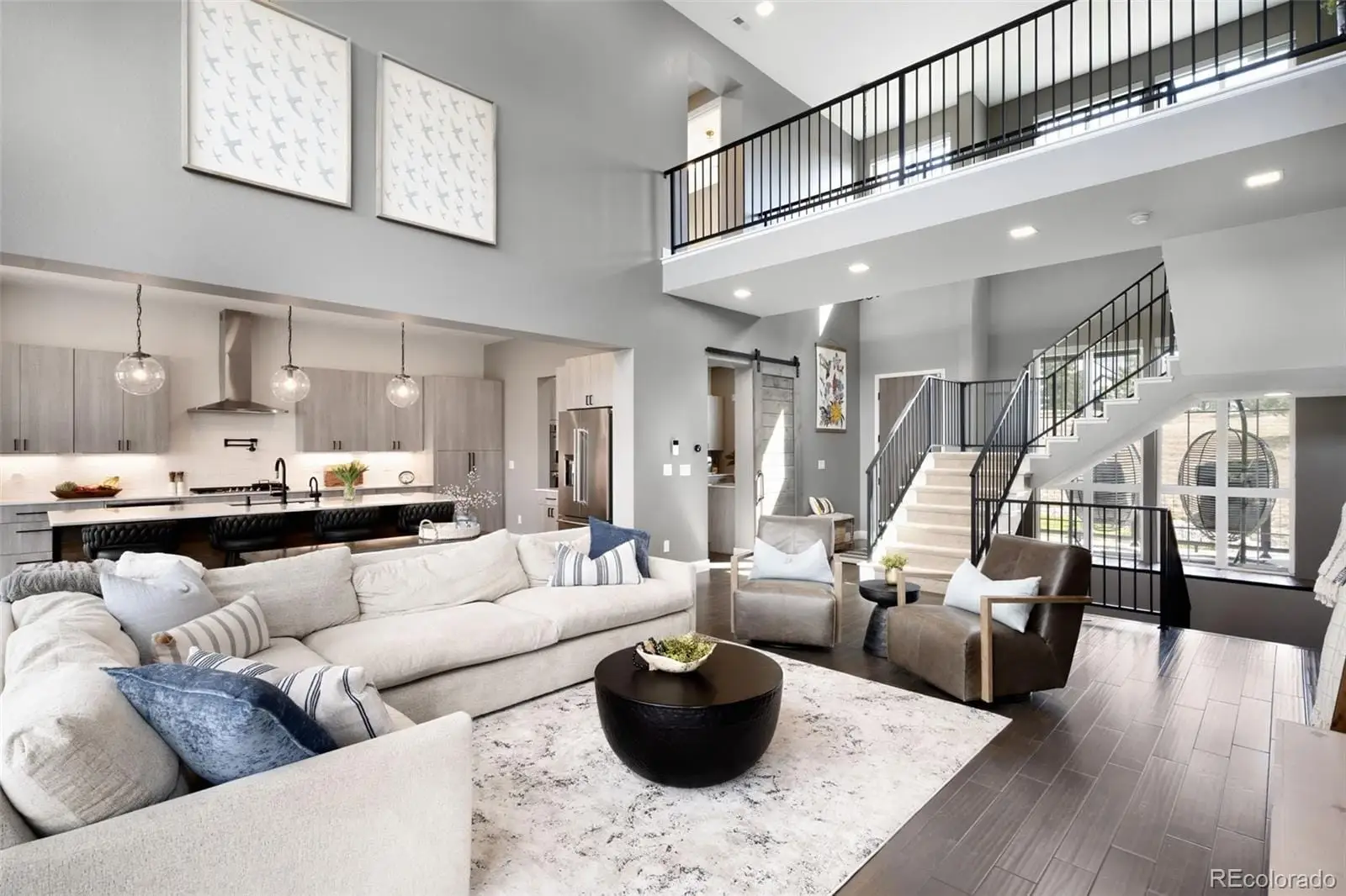 A living room with furniture and wooden floor at 8203 Merryvale Trail