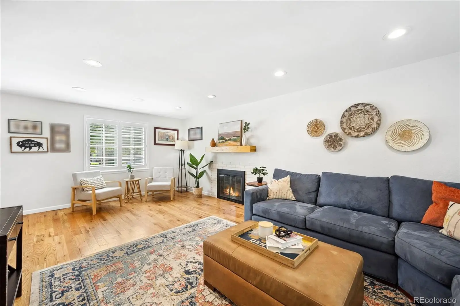 A living room with furniture and wooden floor at 1907 South Leyden Street