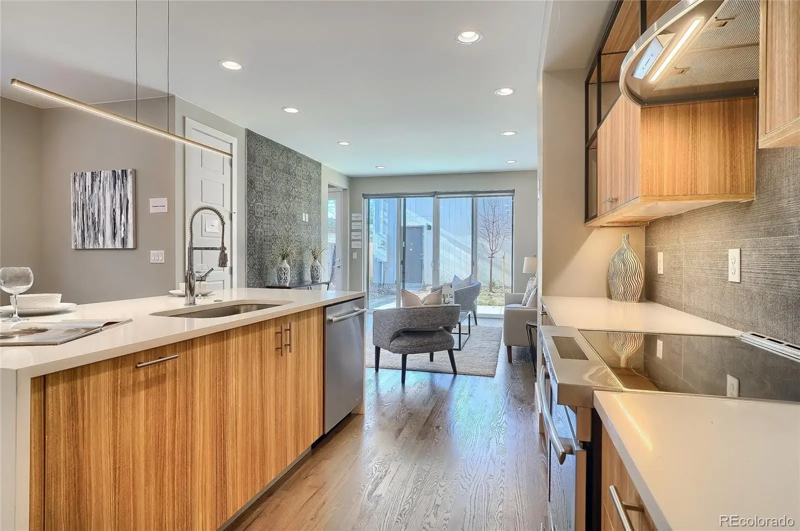 A kitchen with a sink and wooden cabinets at 2843 South Acoma Street